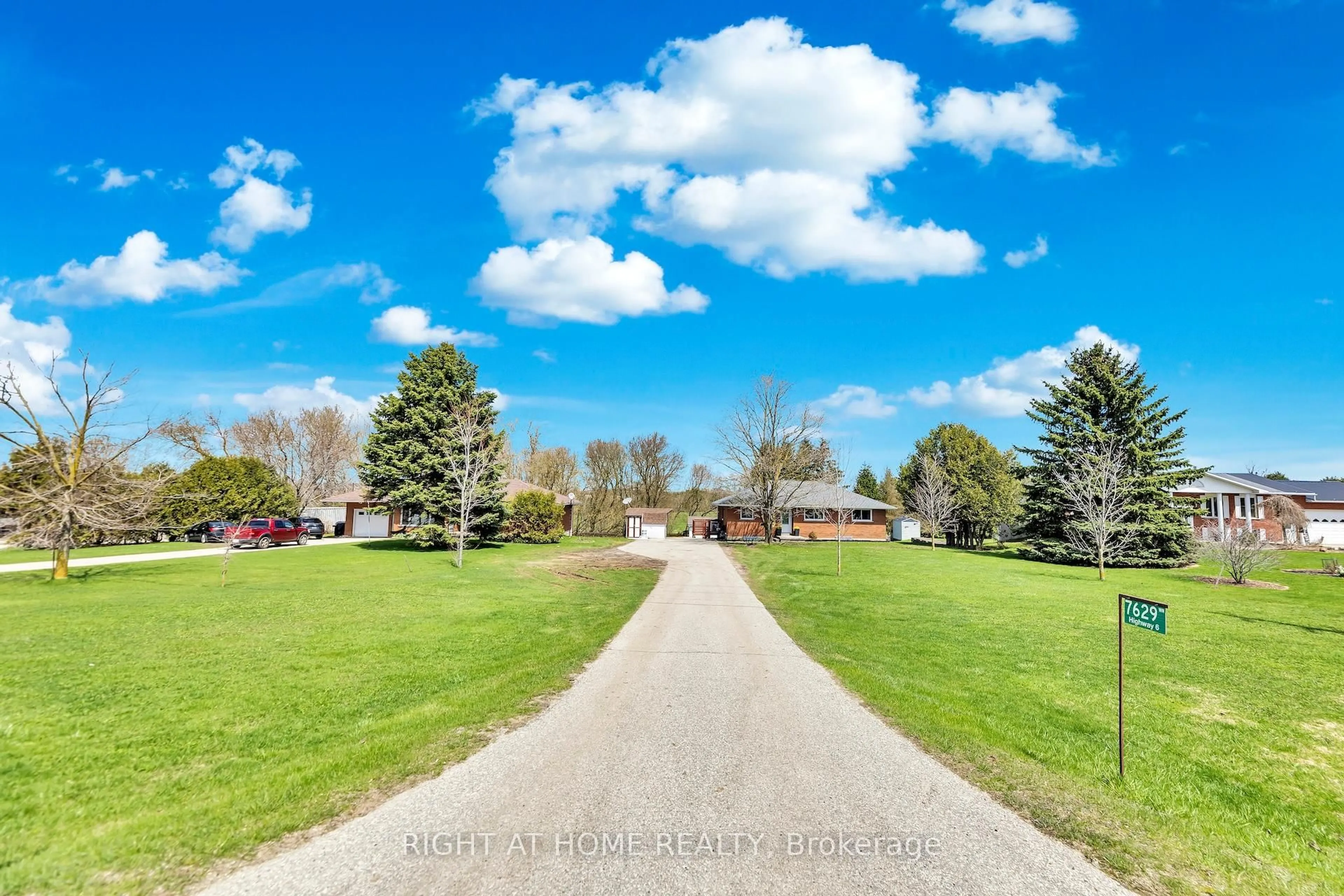 A pic from outside/outdoor area/front of a property/back of a property/a pic from drone, street for 7629 Hwy 6, R.R. # 1 Highway, Wellington North Ontario N0G 1A0