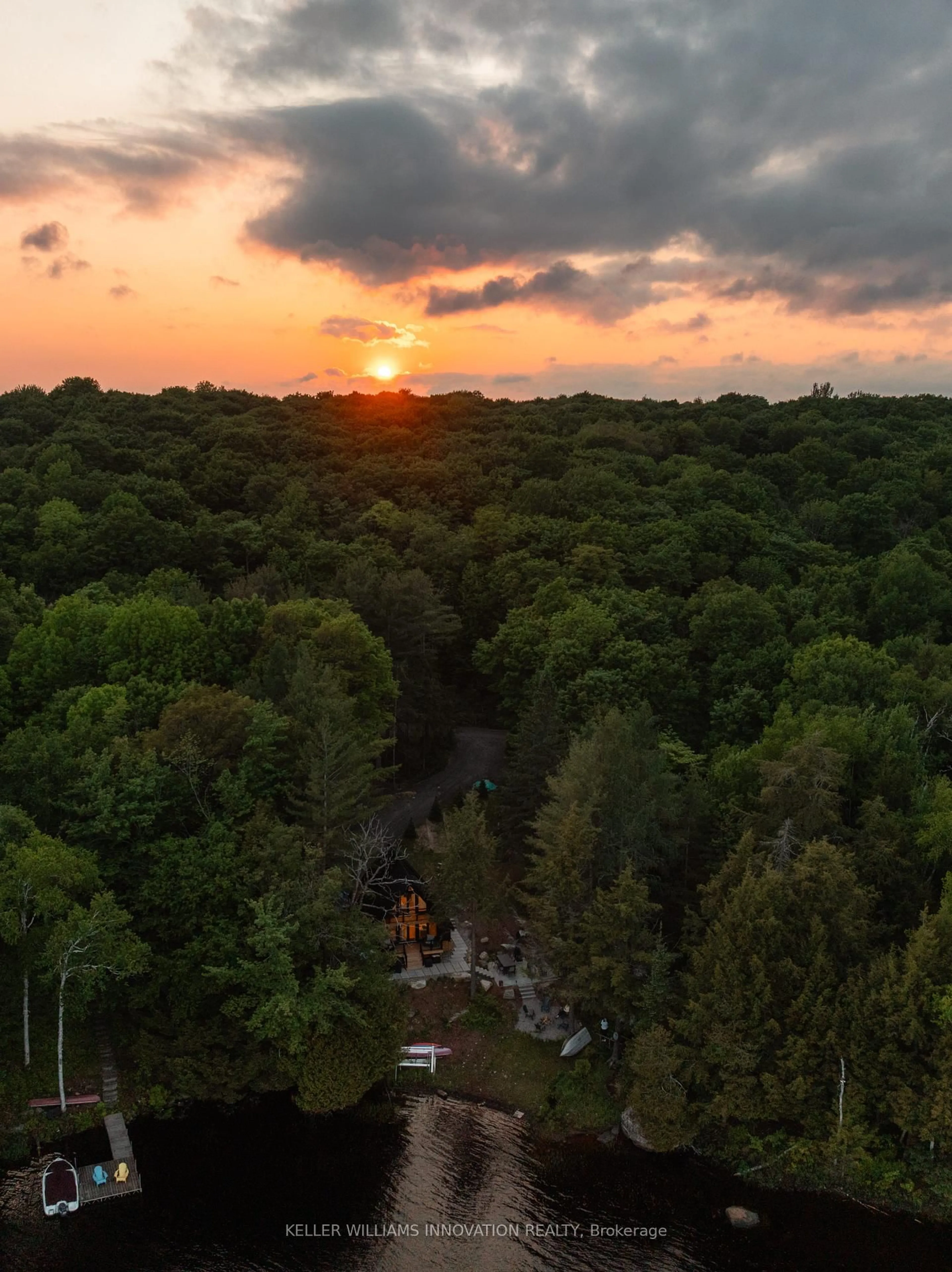 A pic from outside/outdoor area/front of a property/back of a property/a pic from drone, forest/trees view for 201 N Menominee Lake Rd, Huntsville Ontario P1H 2J3