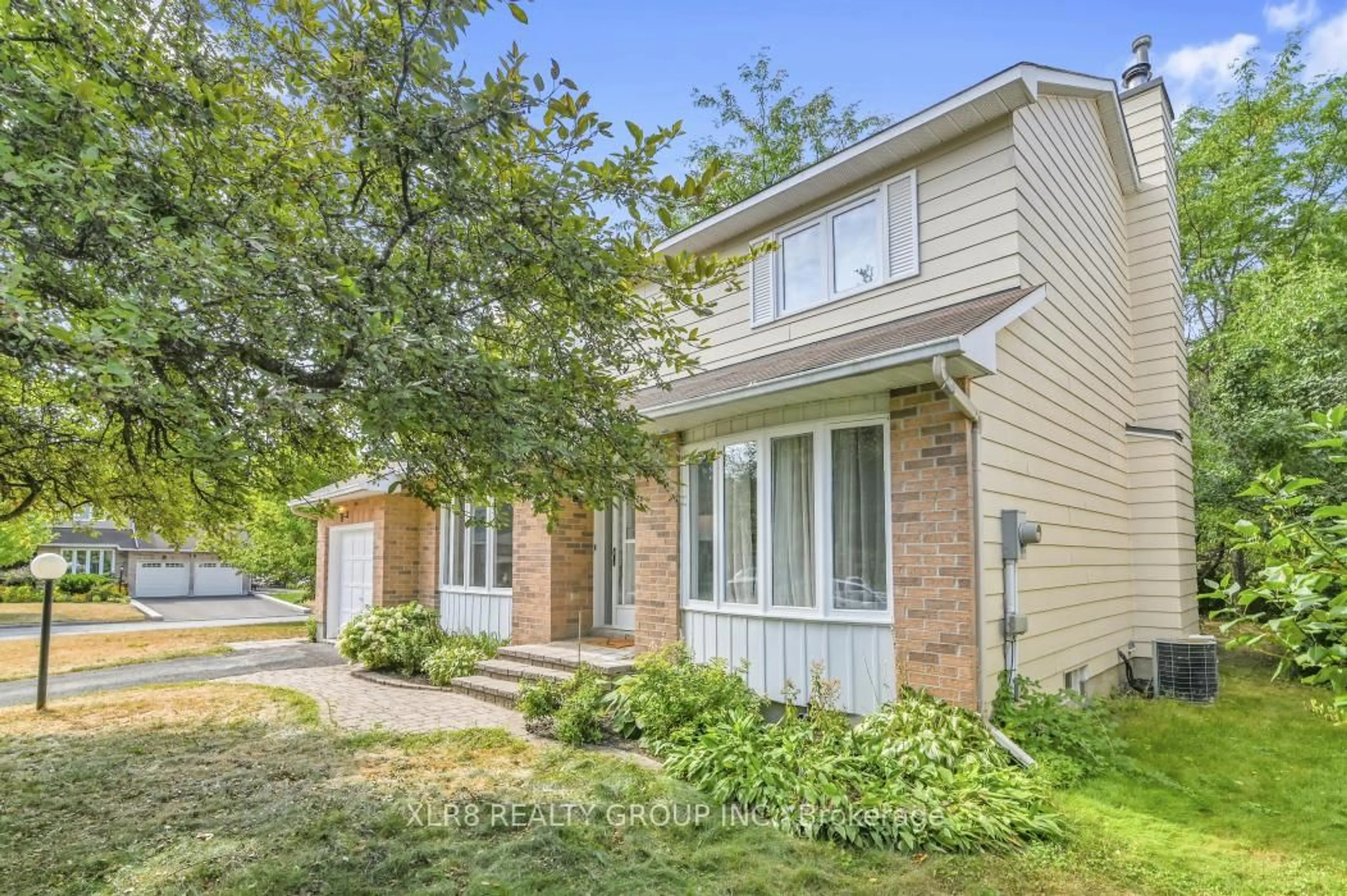Home with brick exterior material, street for 12 John Sidney Cres, Ottawa Ontario K2S 1J7