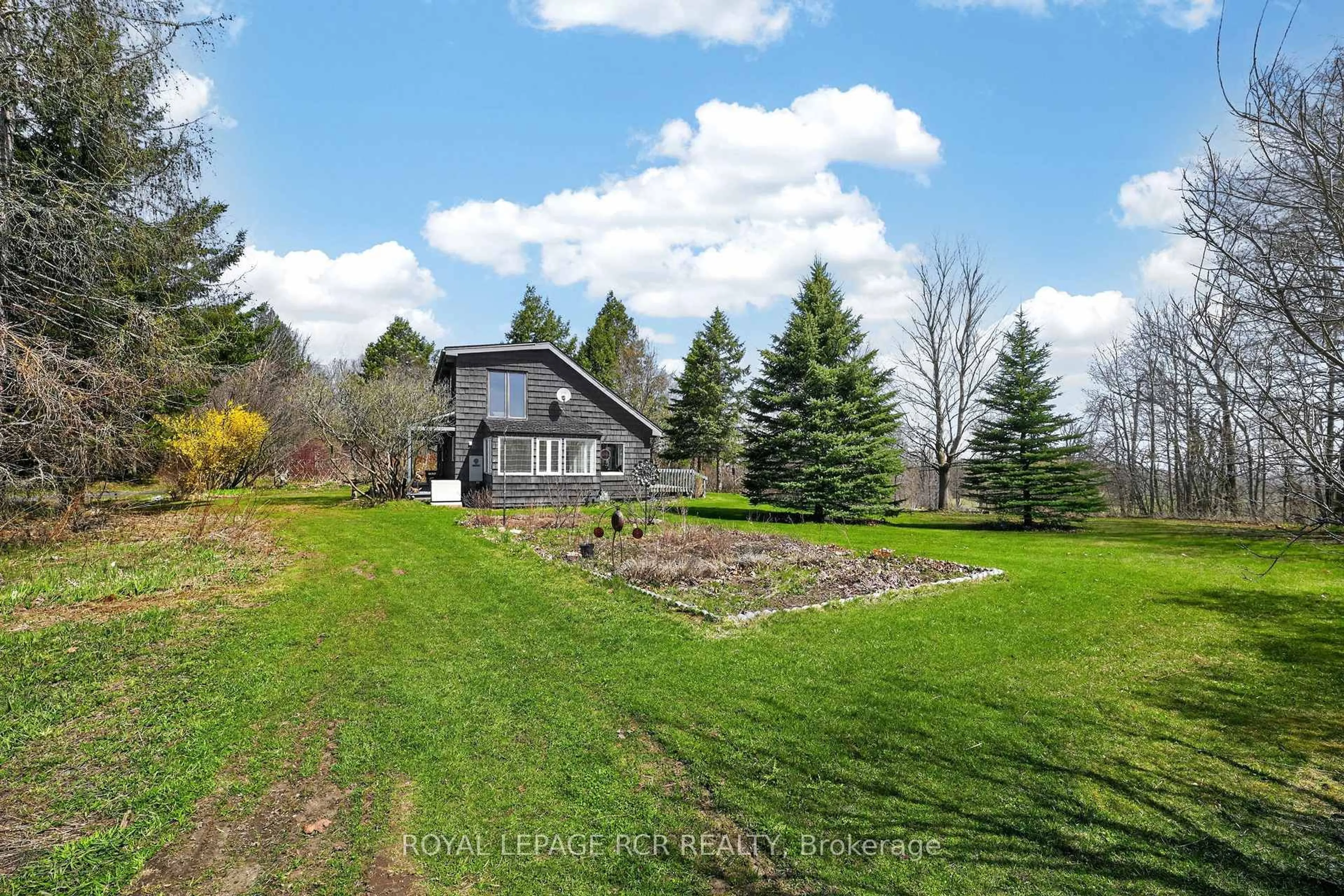 A pic from outside/outdoor area/front of a property/back of a property/a pic from drone, water/lake/river/ocean view for 796343 3rd Line, Mulmur Ontario L9V 0H3