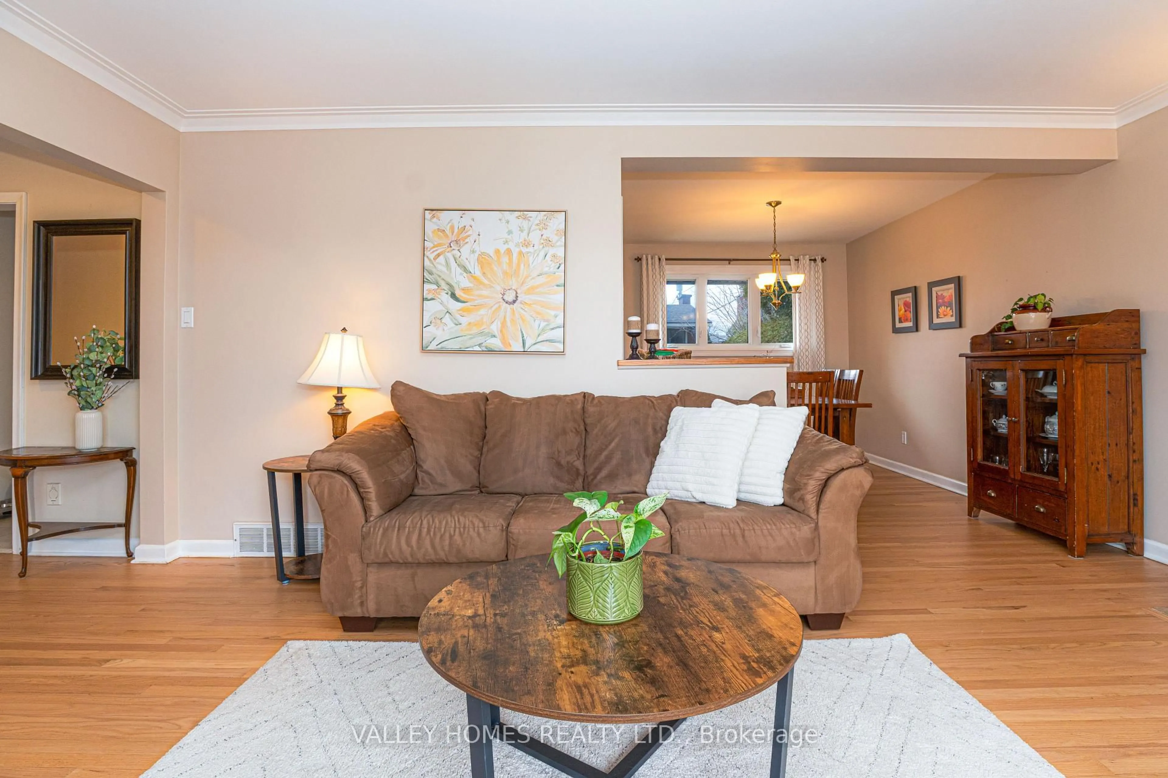 Living room with furniture, wood/laminate floor for 1224 Placid St, Ottawa Ontario K2C 3A6