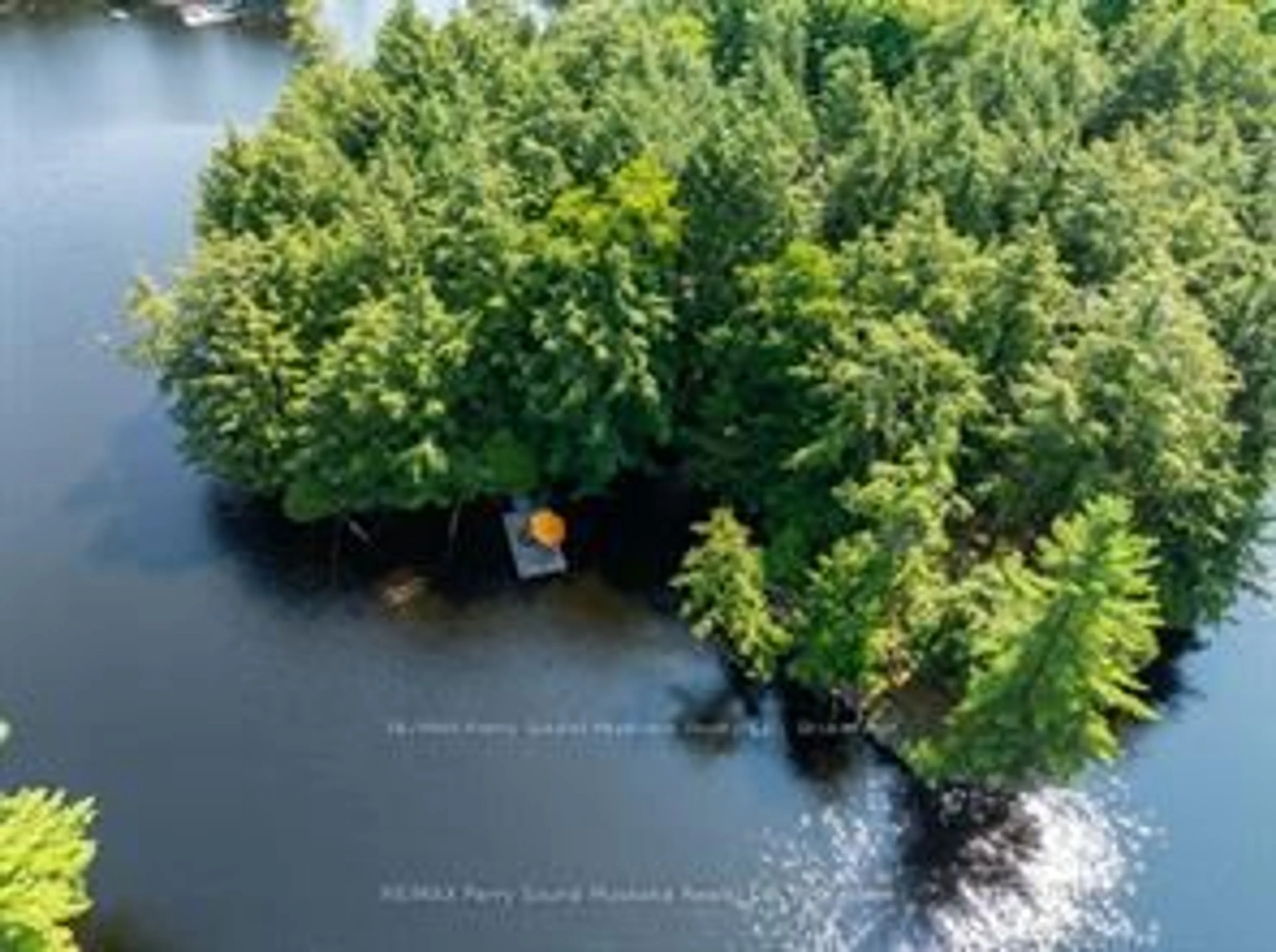 A pic from outside/outdoor area/front of a property/back of a property/a pic from drone, water/lake/river/ocean view for 18 MEHARG Dr, McKellar Ontario P2A 0B5