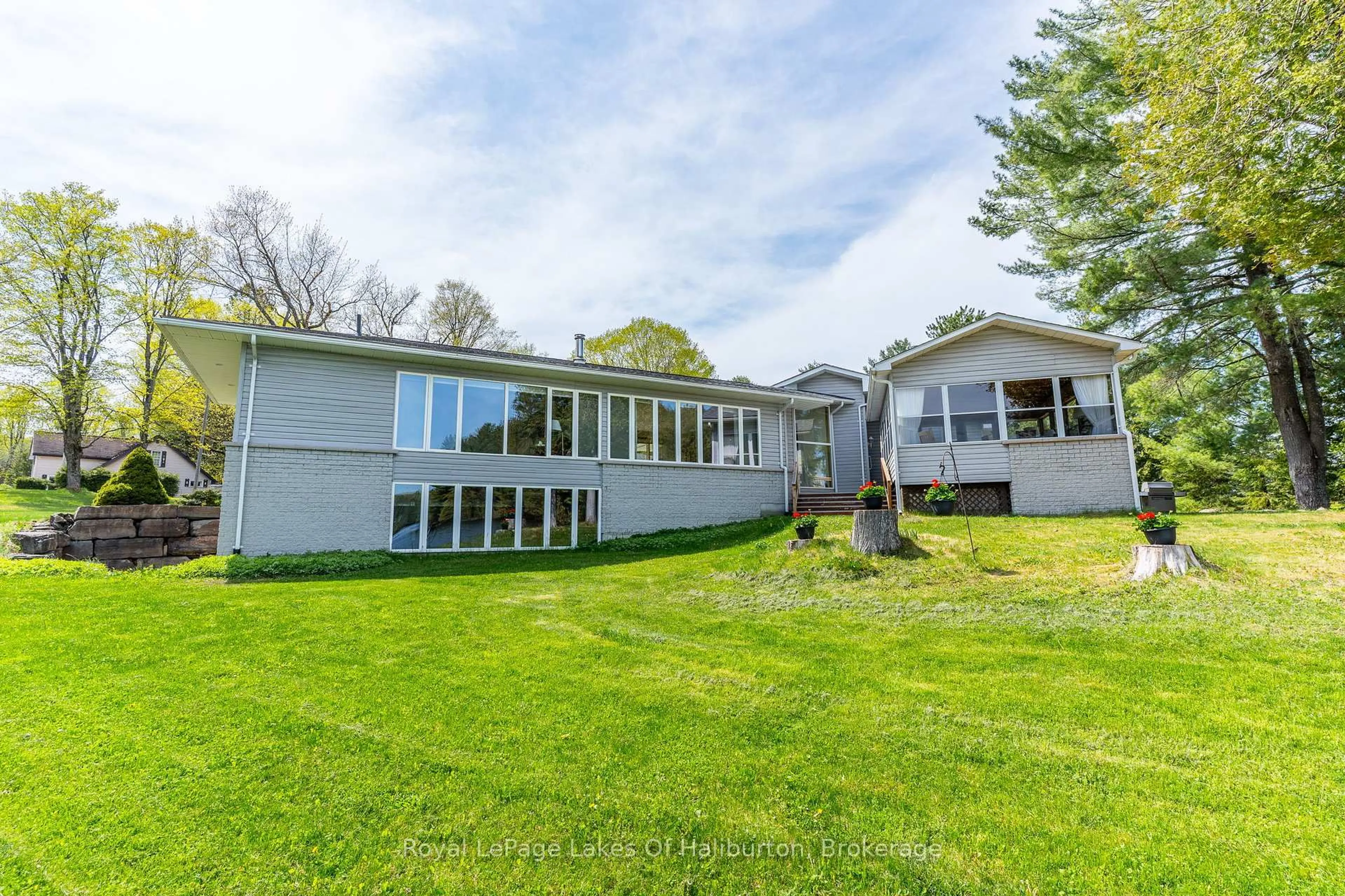 A pic from outside/outdoor area/front of a property/back of a property/a pic from drone, water/lake/river/ocean view for 1089 Pioneer Rd, Highlands East Ontario K0M 1R0