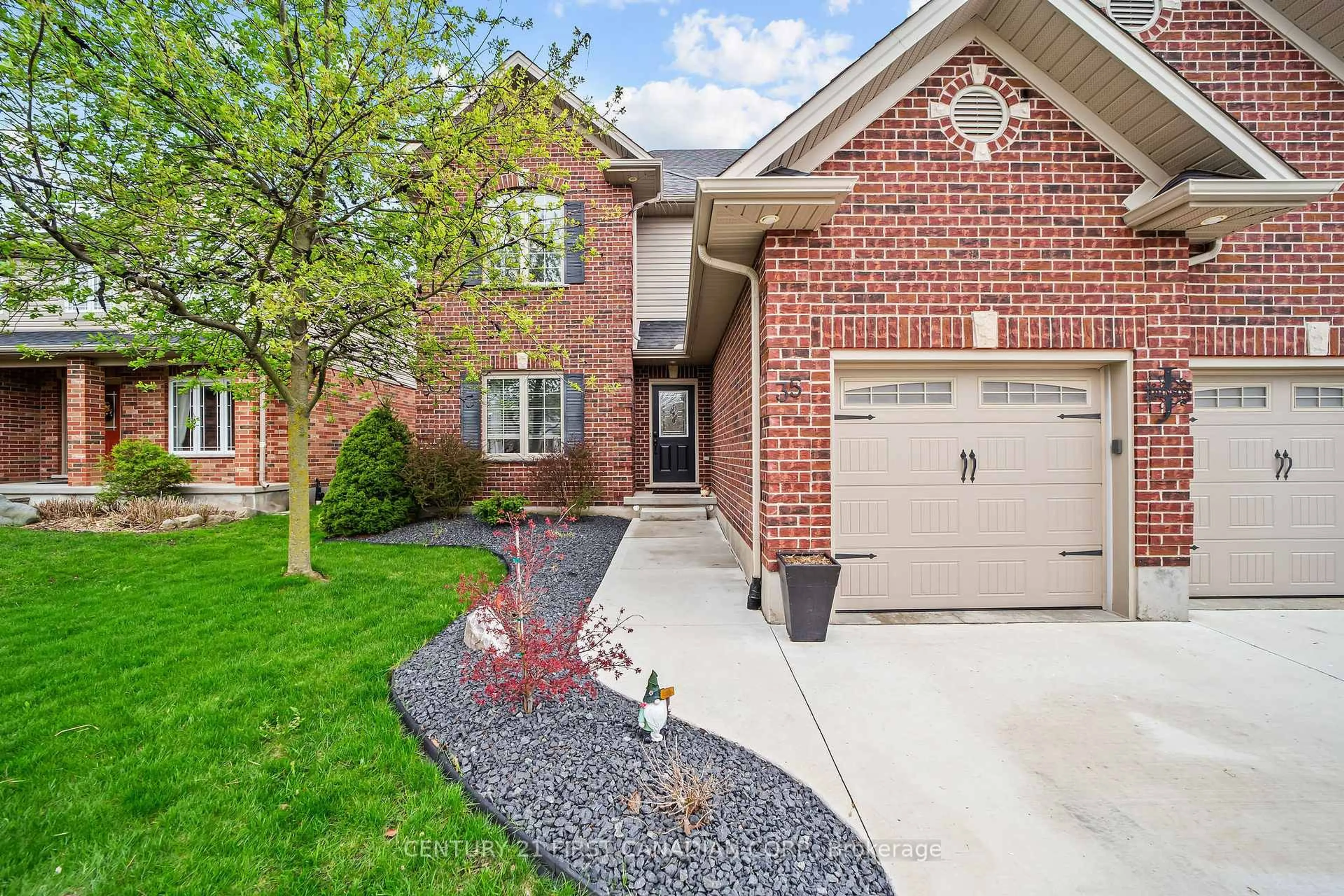 Home with brick exterior material, street for 35 Wood Lily Lane, Middlesex Centre Ontario N0M 2A0