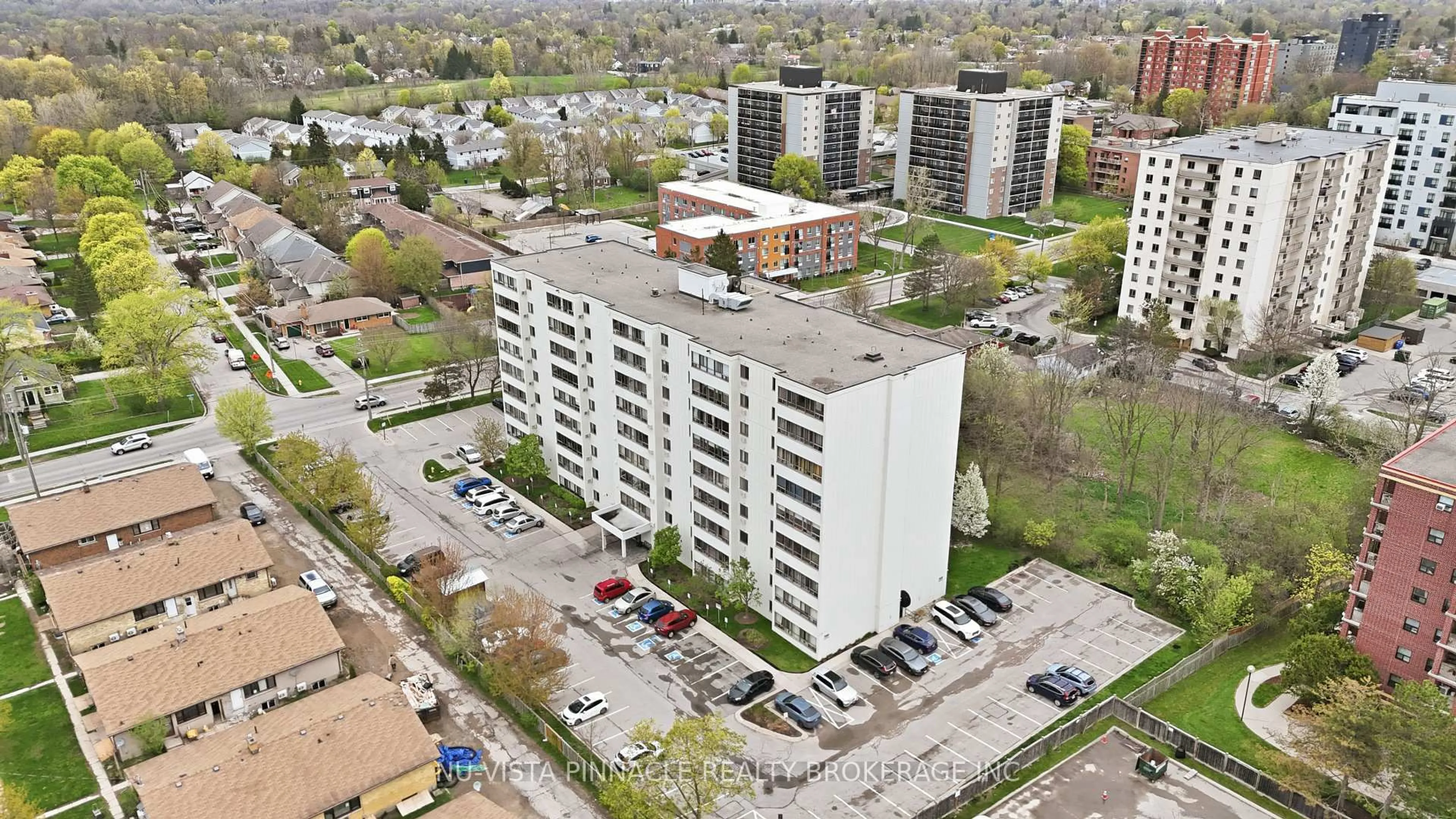 A pic from outside/outdoor area/front of a property/back of a property/a pic from drone, city buildings view from balcony for 135 Baseline Rd #104, London South Ontario N6J 4W4