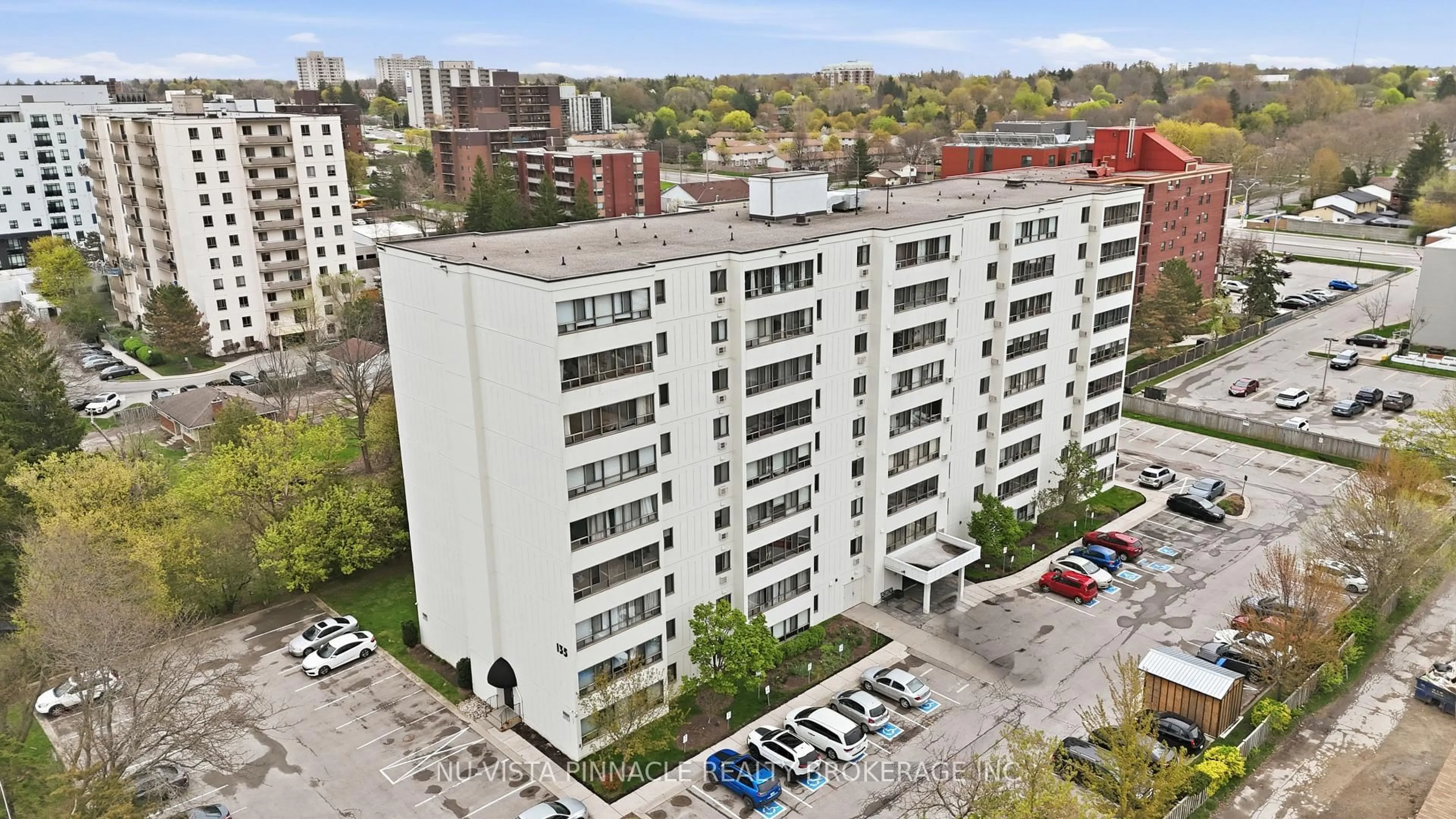 A pic from outside/outdoor area/front of a property/back of a property/a pic from drone, city buildings view from balcony for 135 Baseline Rd #104, London South Ontario N6J 4W4