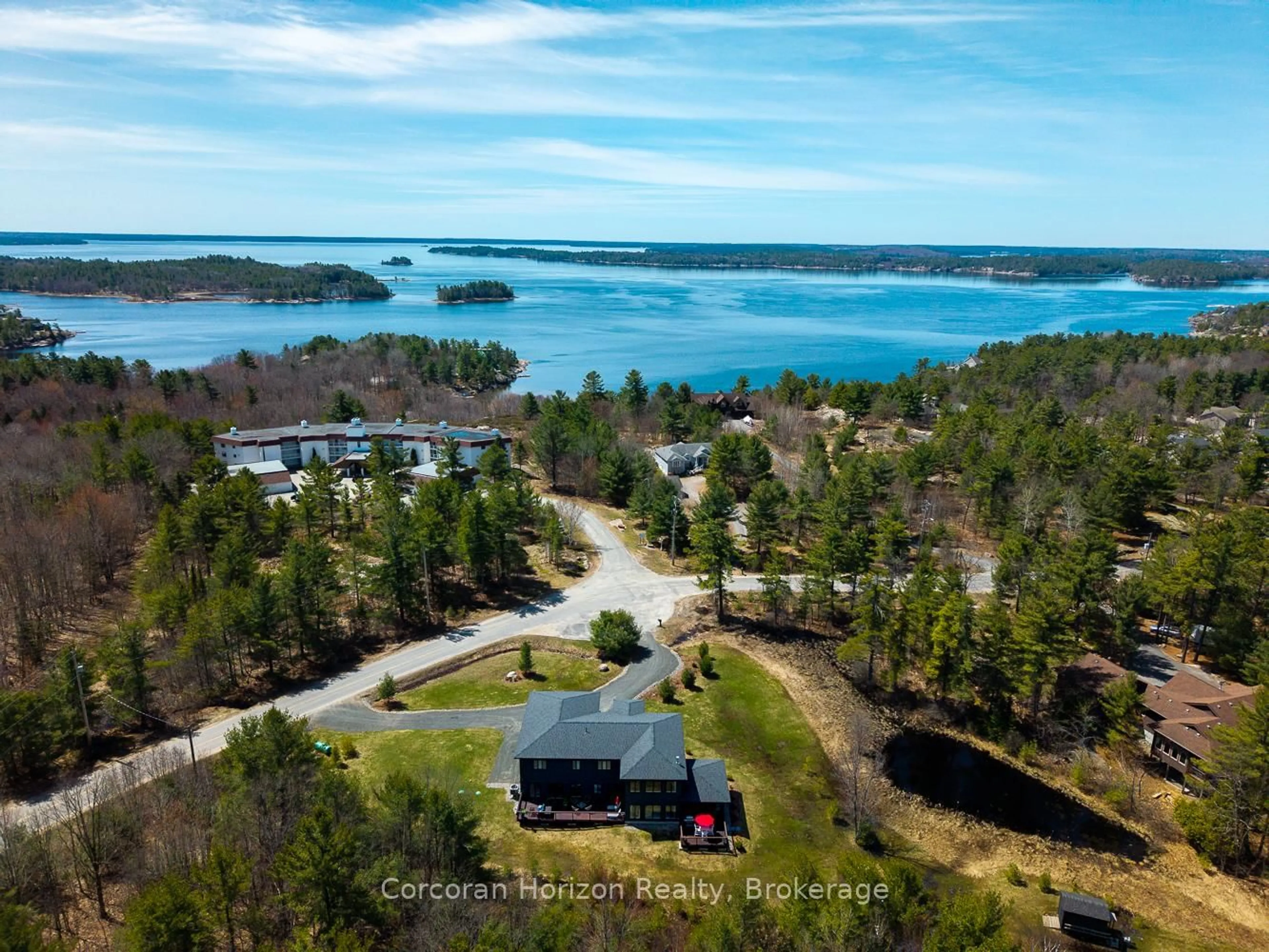 A pic from outside/outdoor area/front of a property/back of a property/a pic from drone, water/lake/river/ocean view for 19 Ryder Dr, McDougall Ontario P2A 2W9