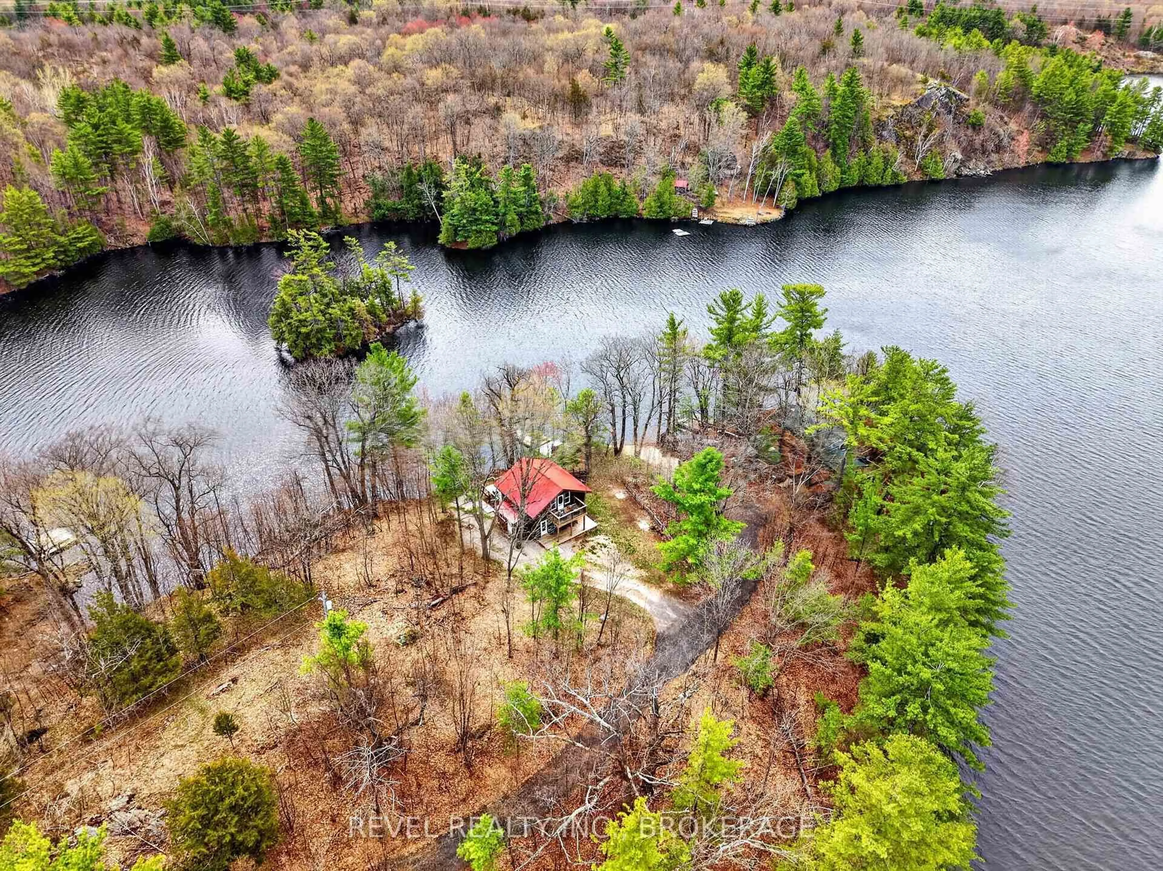A pic from outside/outdoor area/front of a property/back of a property/a pic from drone, water/lake/river/ocean view for 341 Tim's Lane, Godfrey Ontario K0H 1T0