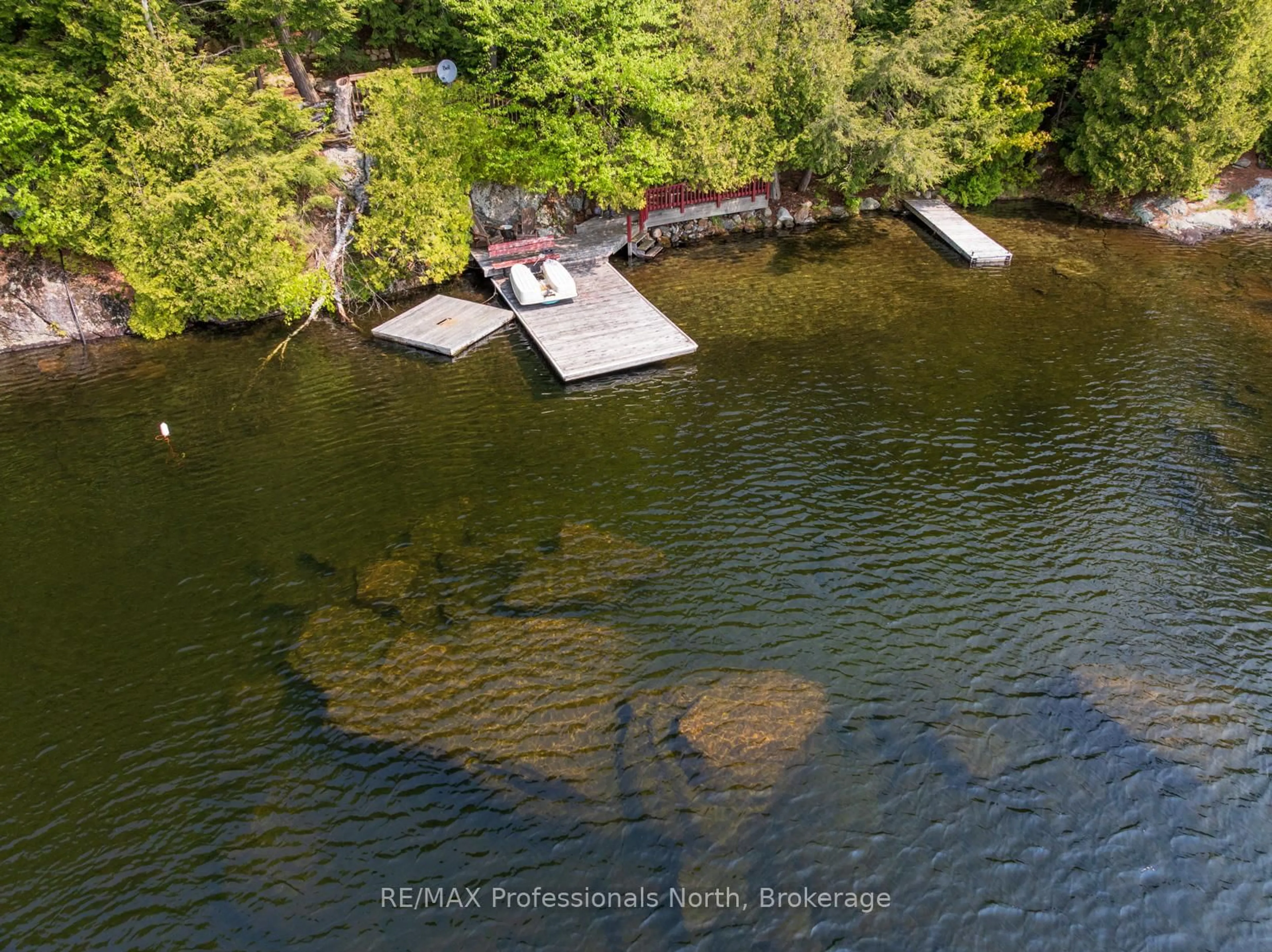 A pic from outside/outdoor area/front of a property/back of a property/a pic from drone, water/lake/river/ocean view for 255 Cedar Lane, Kearney Ontario P0A 1M0