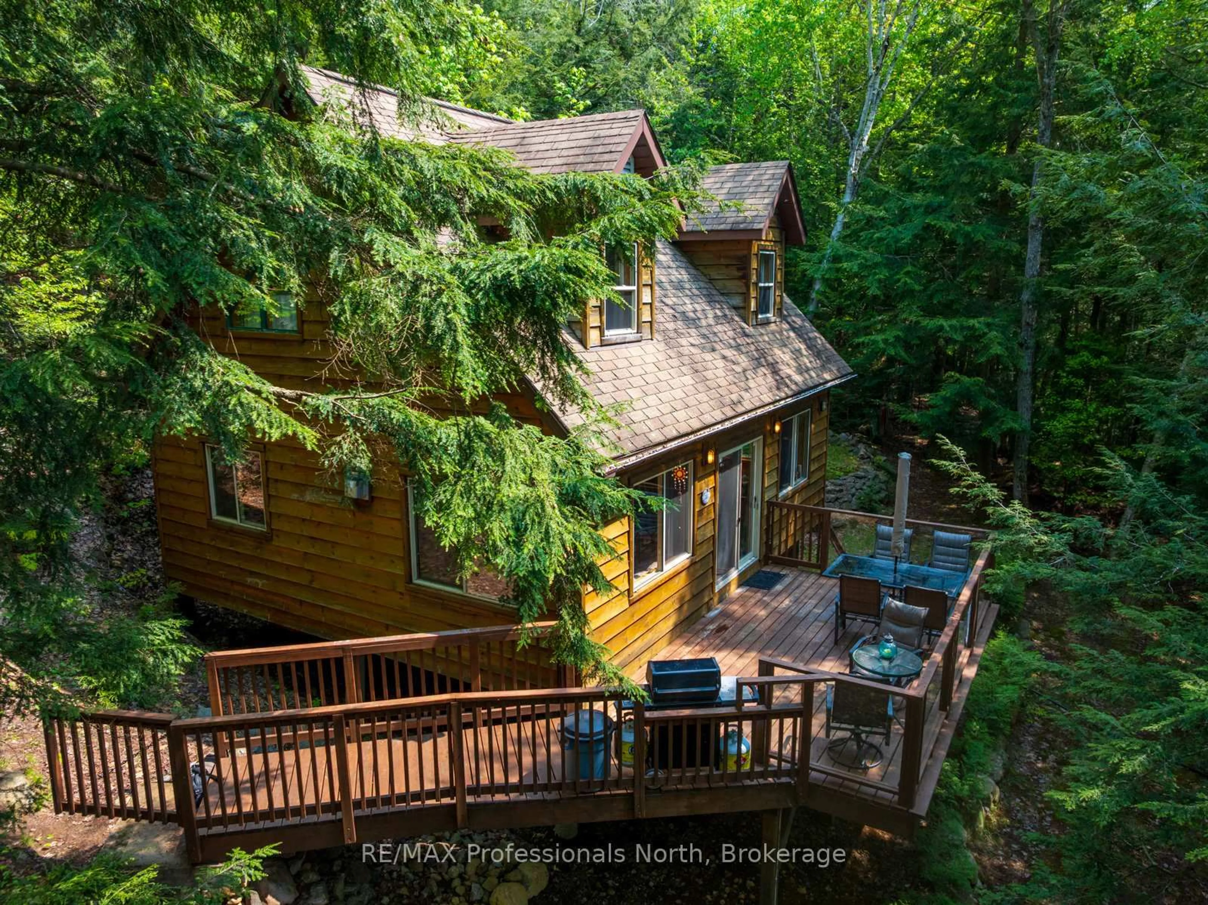 A pic from outside/outdoor area/front of a property/back of a property/a pic from drone, forest/trees view for 255 Cedar Lane, Kearney Ontario P0A 1M0