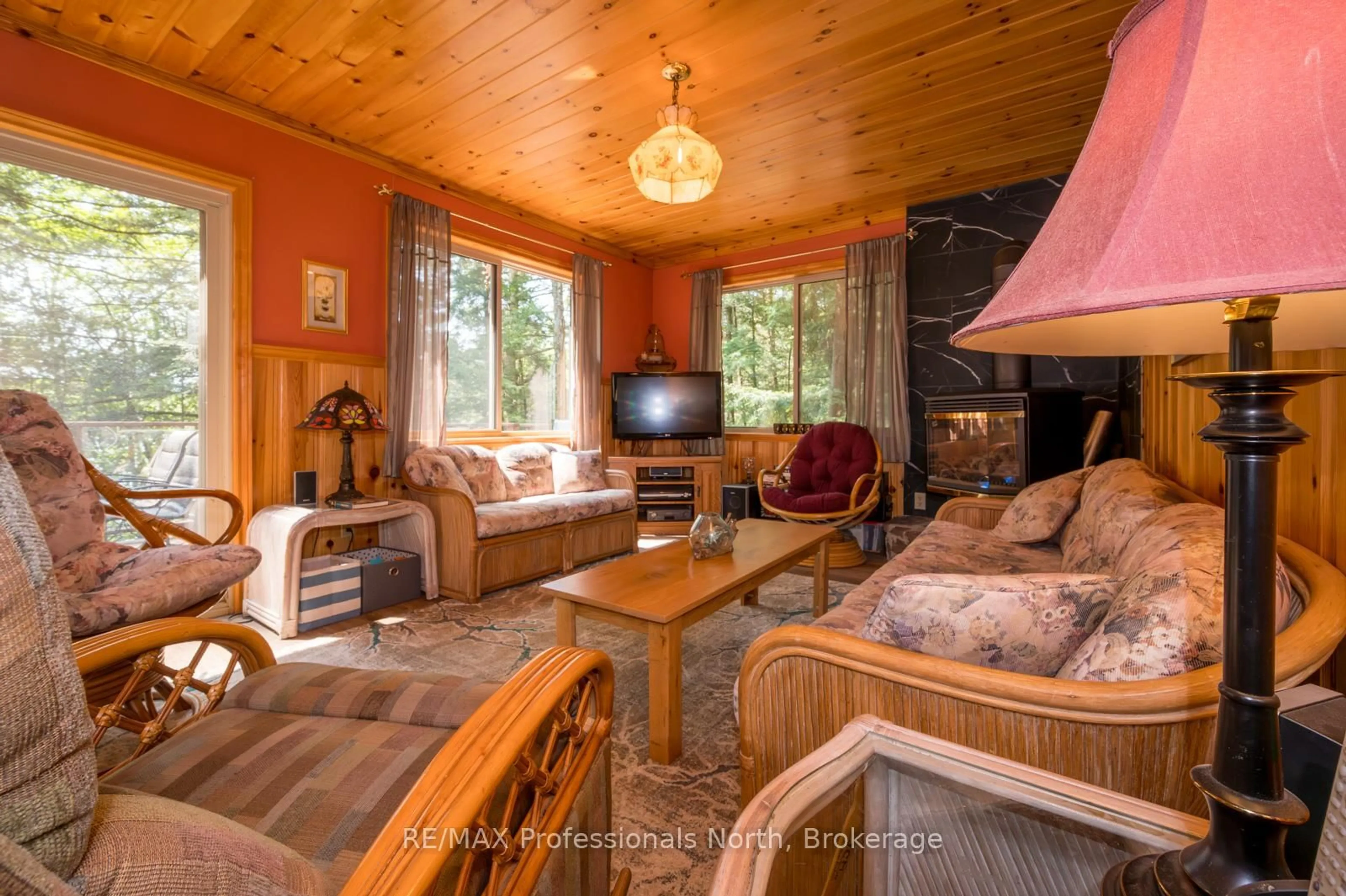 Living room with furniture, wood/laminate floor for 255 Cedar Lane, Kearney Ontario P0A 1M0