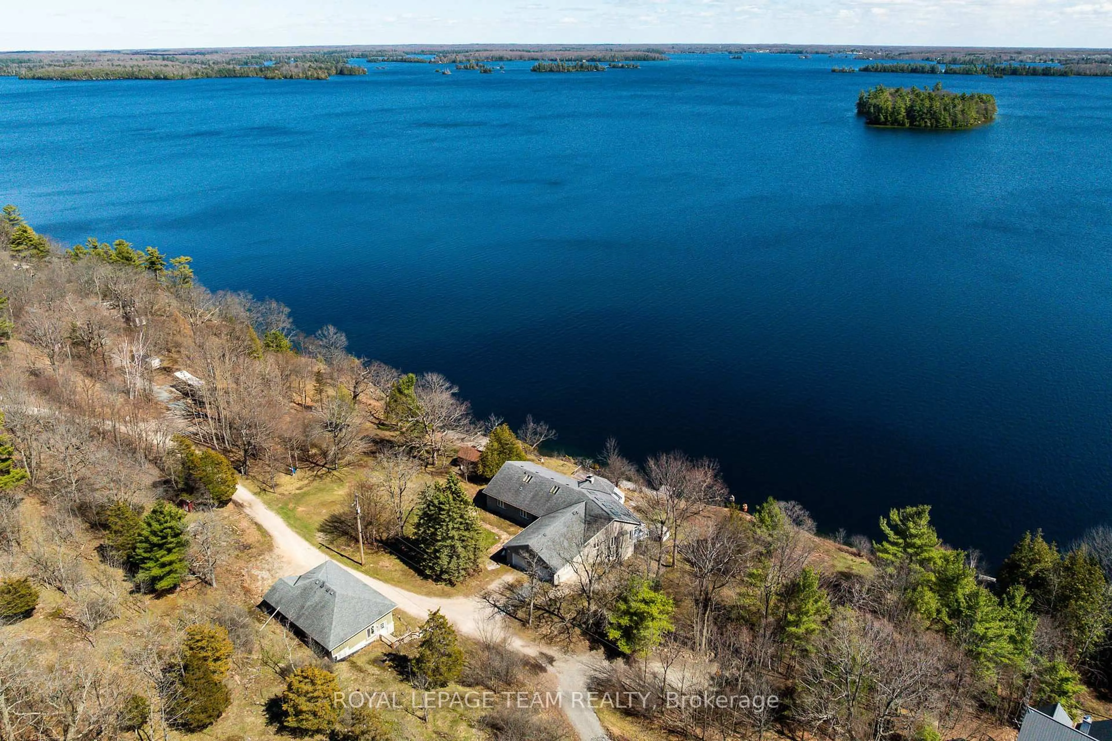 A pic from outside/outdoor area/front of a property/back of a property/a pic from drone, water/lake/river/ocean view for 605 Big Rideau North Shore Rd, Perth Ontario K7H 3C5