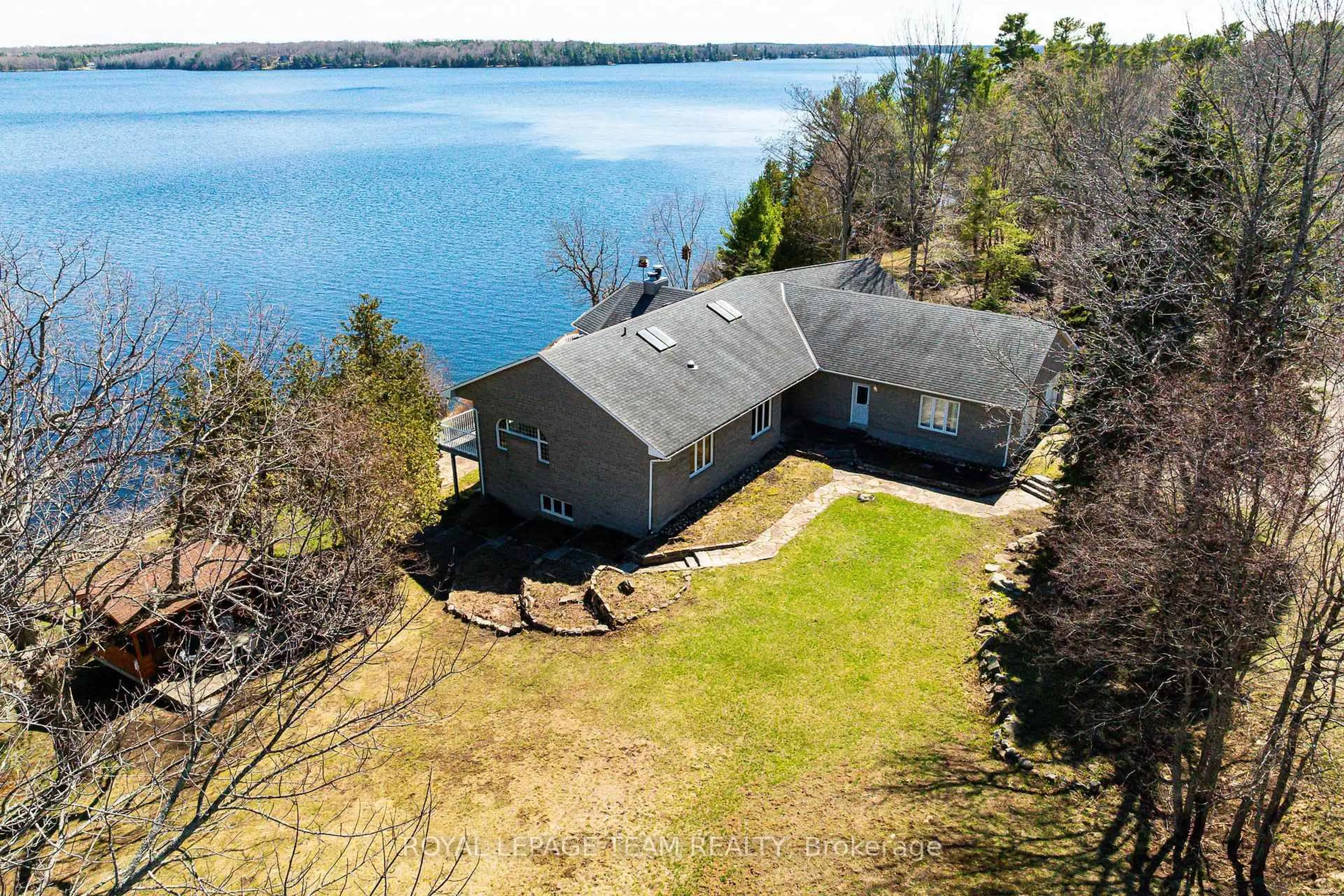 A pic from outside/outdoor area/front of a property/back of a property/a pic from drone, water/lake/river/ocean view for 605 Big Rideau North Shore Rd, Perth Ontario K7H 3C5