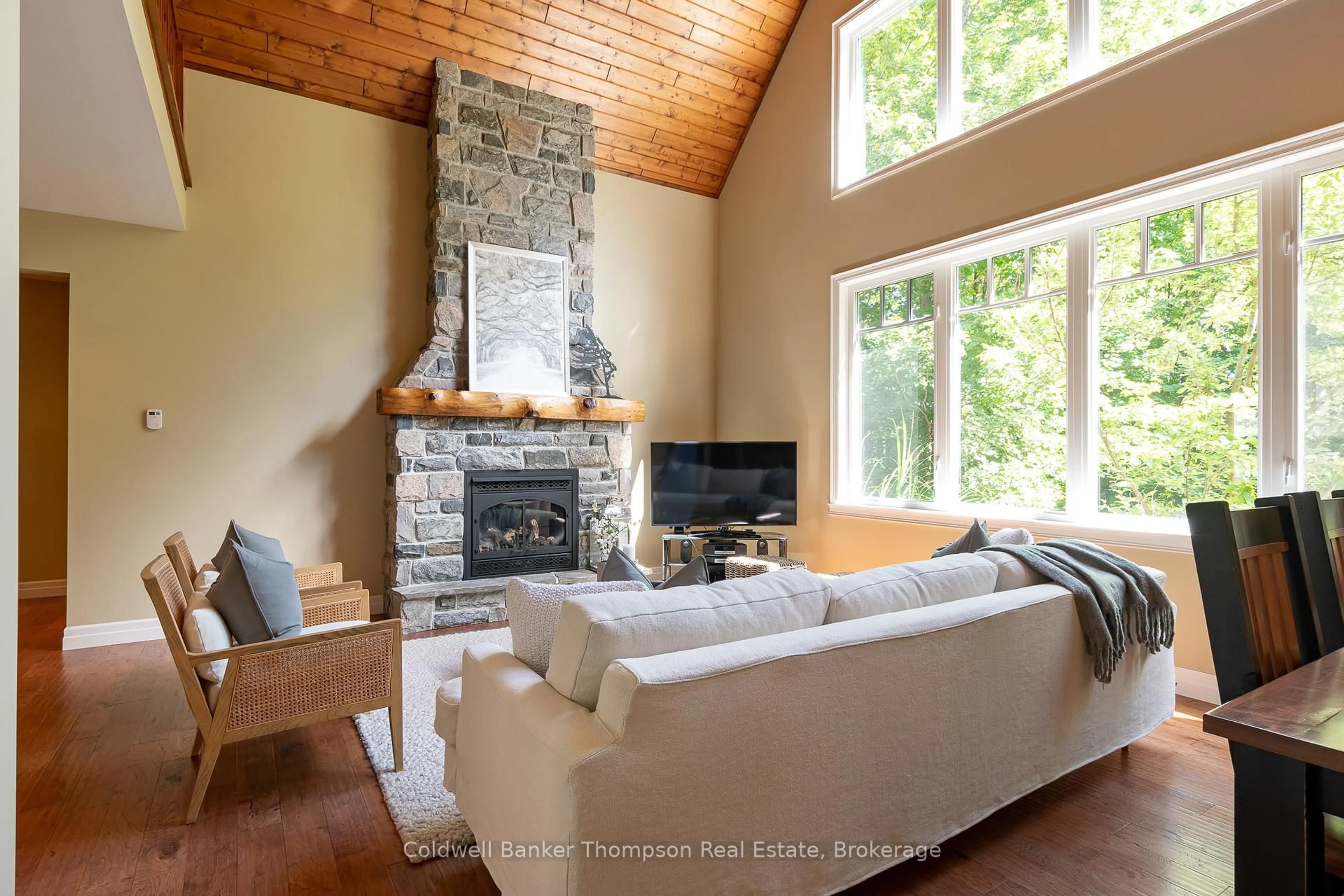 Living room with furniture, wood/laminate floor for 11 Forest Hill Lane, Huntsville Ontario P1H 2N5