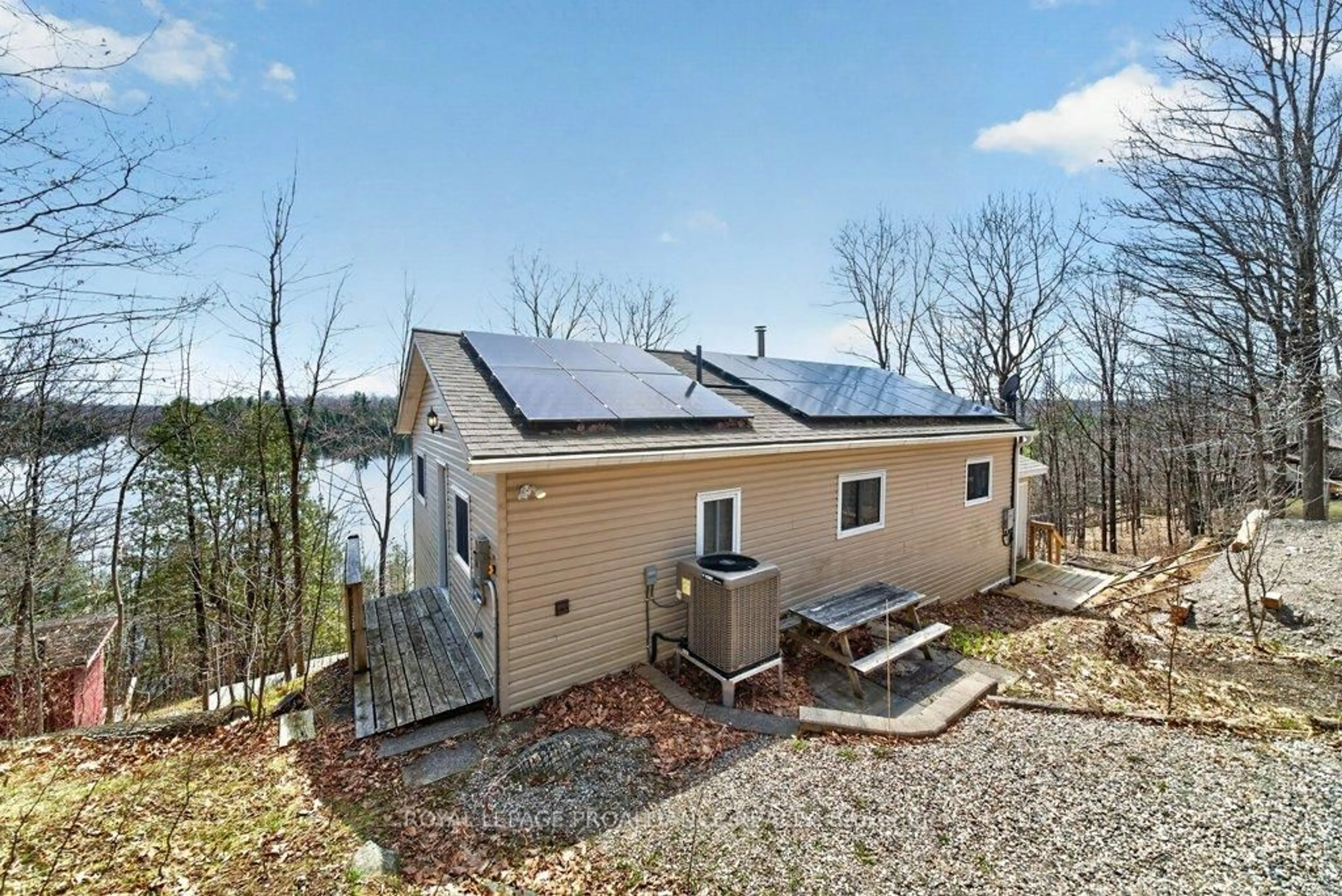 A pic from outside/outdoor area/front of a property/back of a property/a pic from drone, water/lake/river/ocean view for 1076 Valley Lane, Sharbot Lake Ontario K0H 2P0