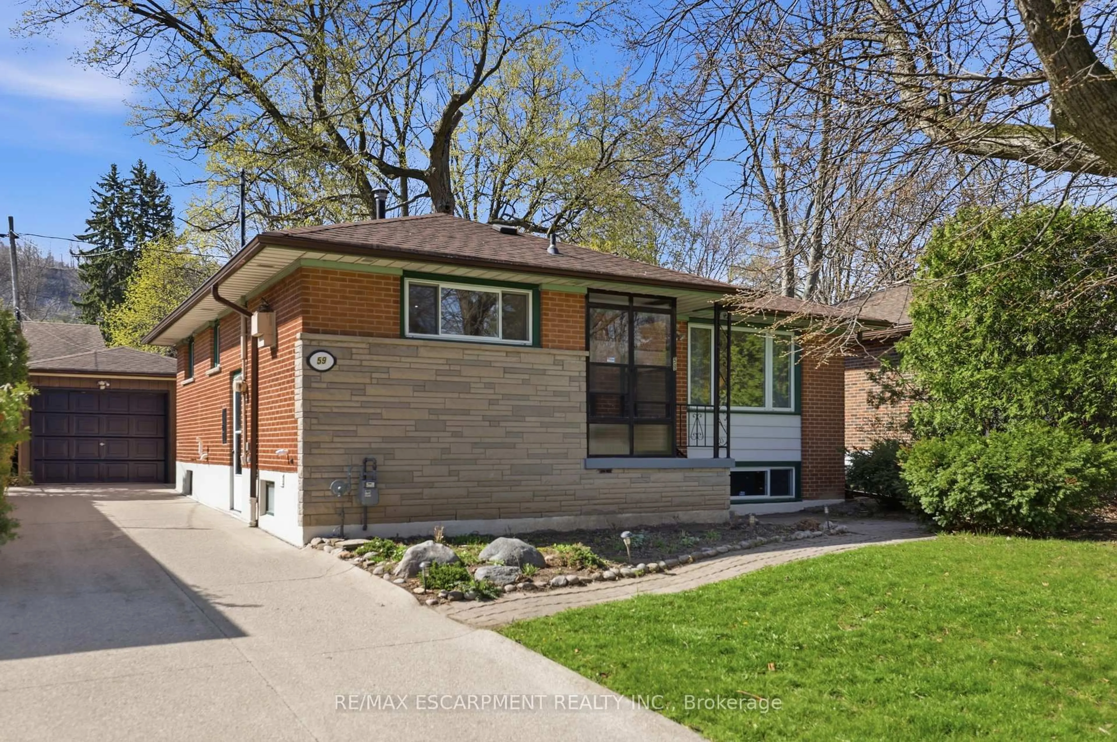 Home with brick exterior material, street for 59 Purvis Dr, Hamilton Ontario L8S 2S5