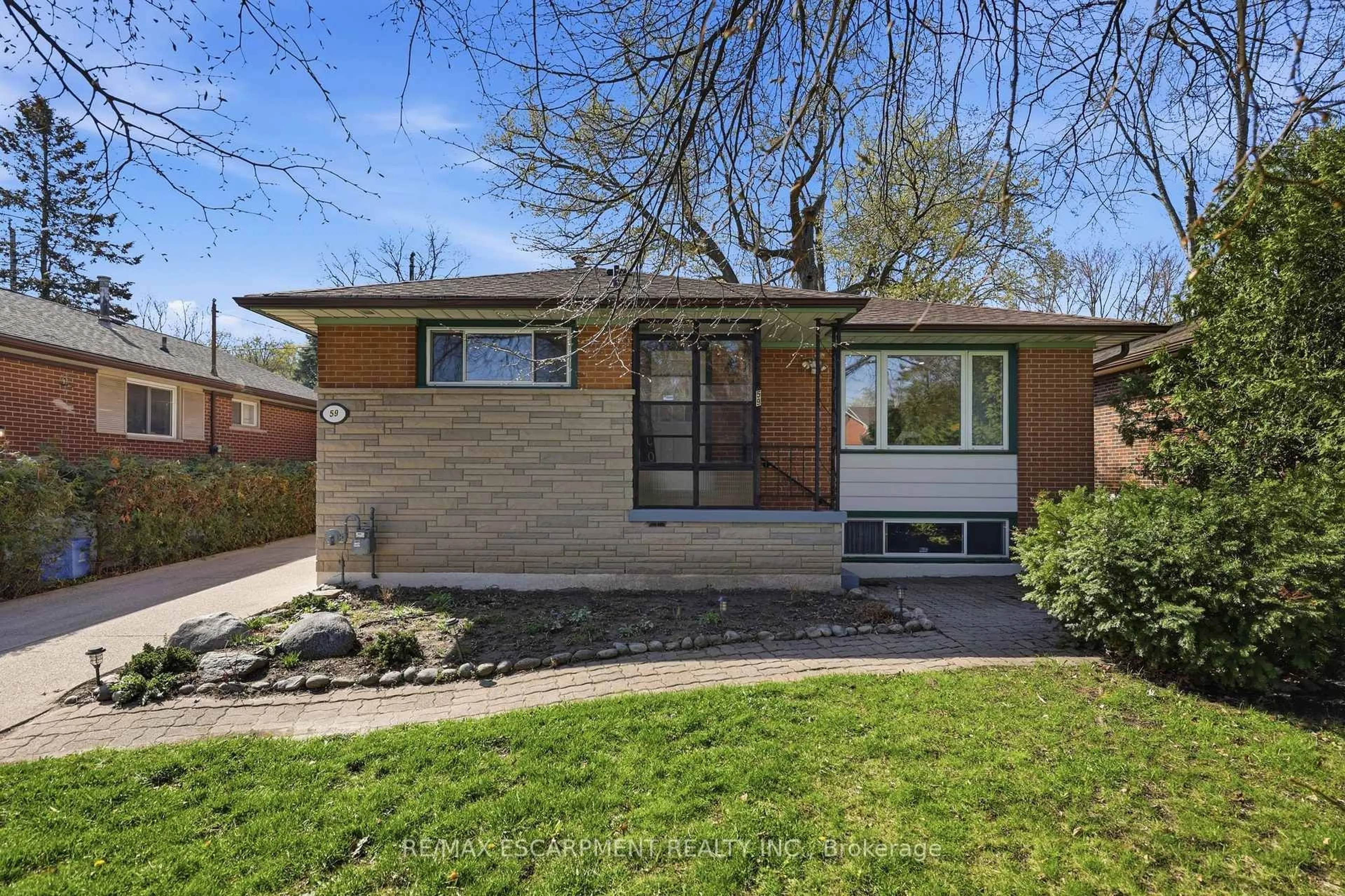 Home with brick exterior material, street for 59 Purvis Dr, Hamilton Ontario L8S 2S5