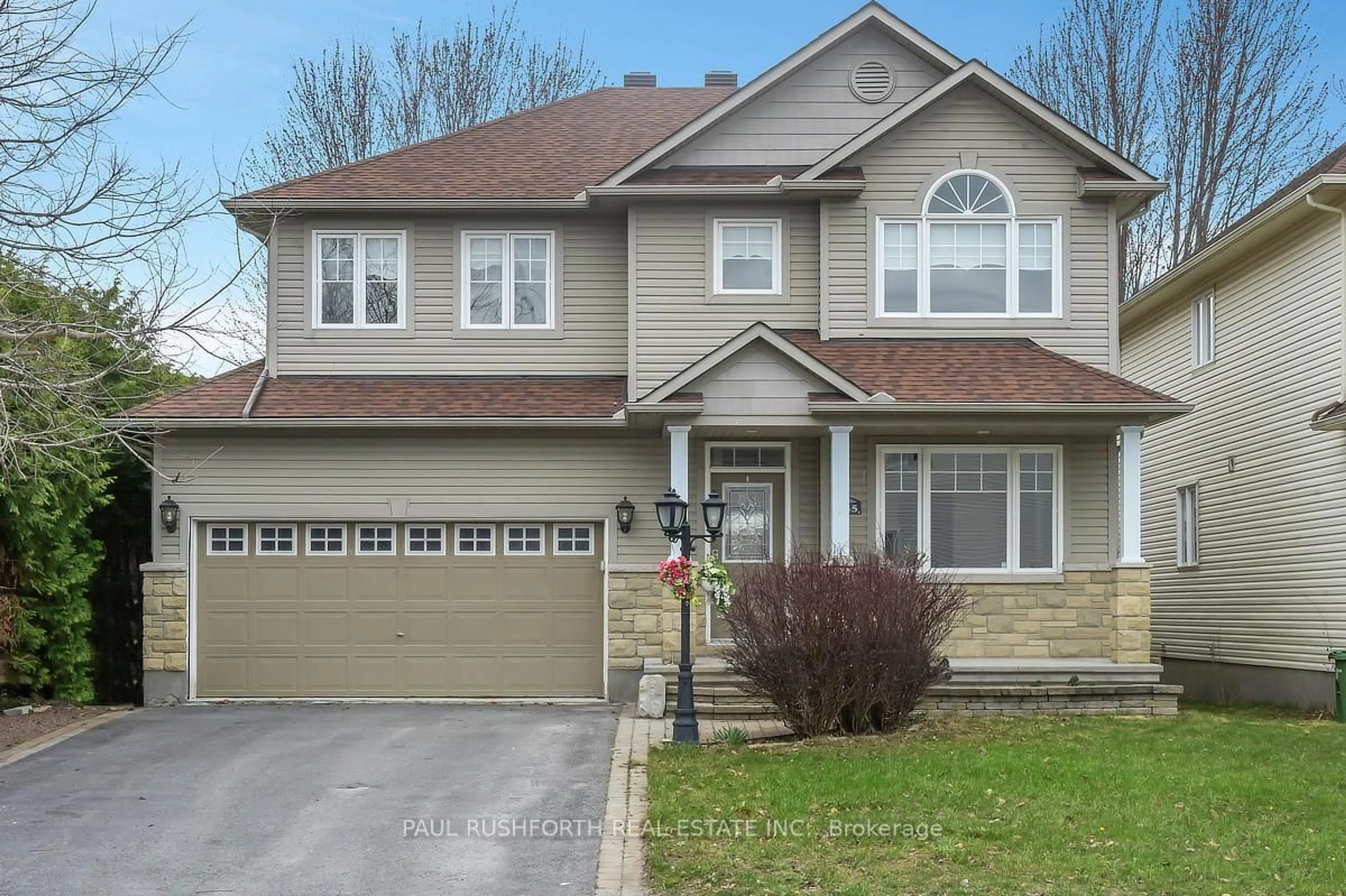 Home with vinyl exterior material, street for 145 Arrowwood Dr, Stittsville Ontario K2S 2G3
