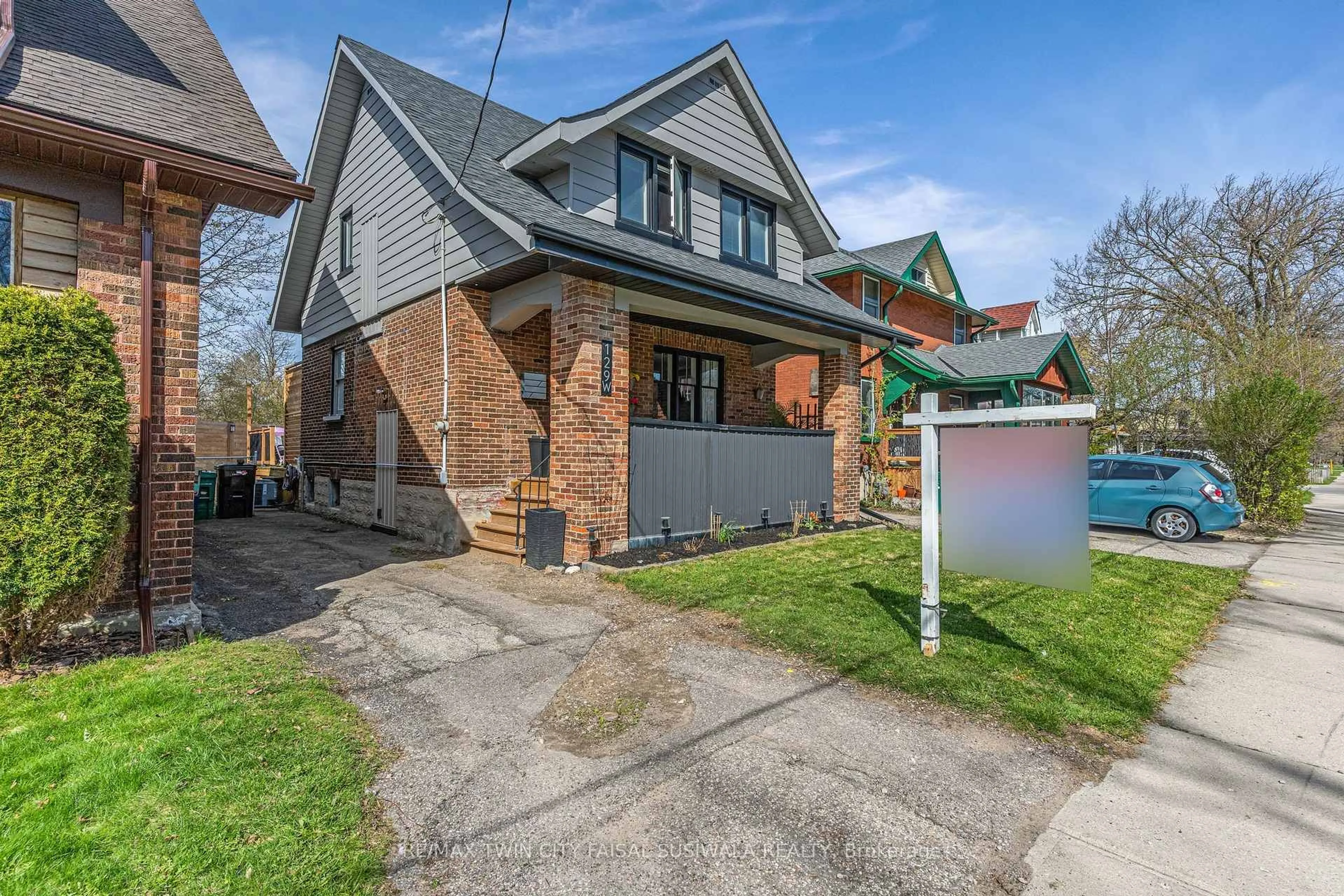 Home with brick exterior material, street for 129 Ahrens St, Kitchener Ontario N2H 4C4