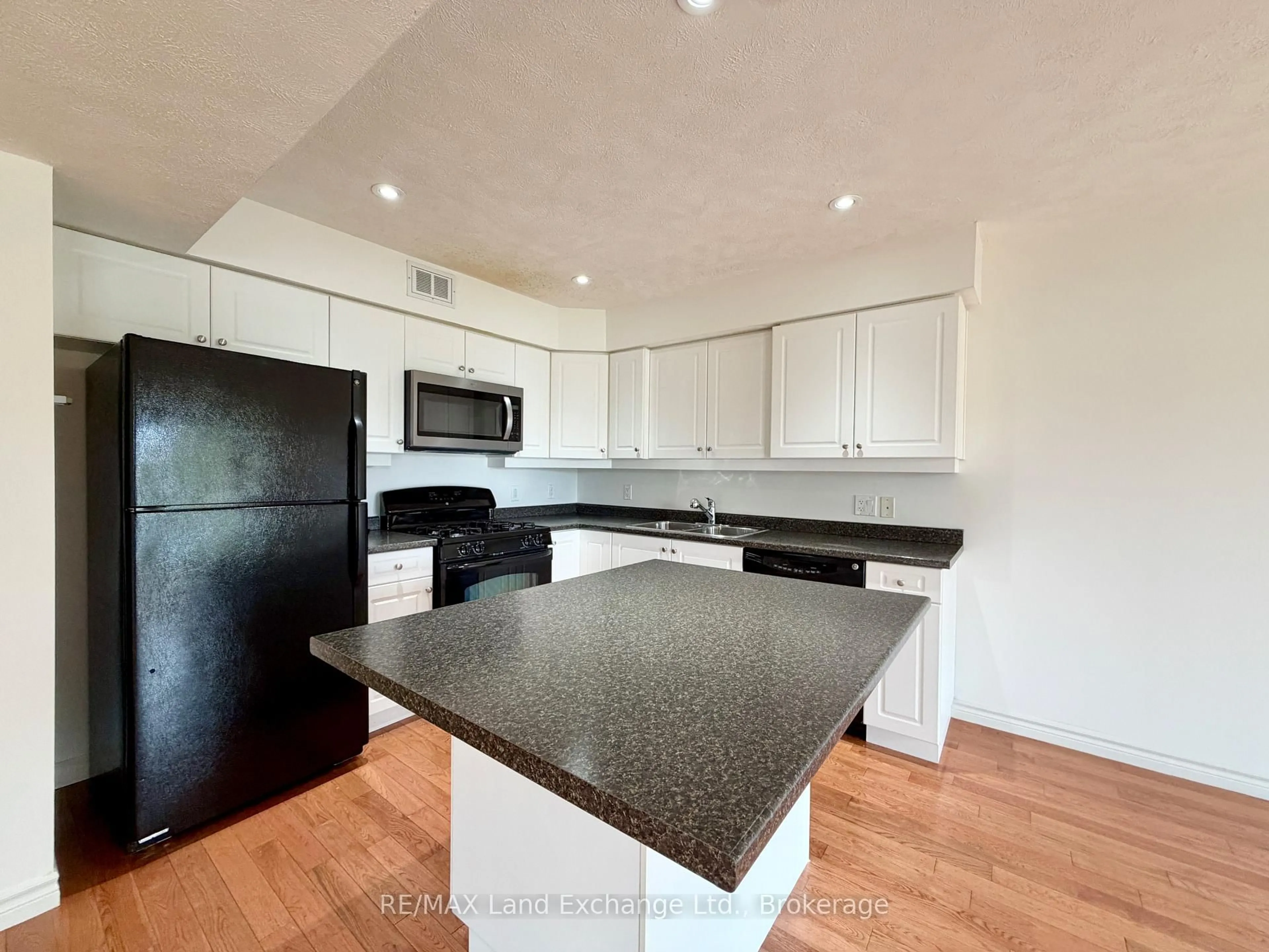 Open concept kitchen, wood/laminate floor for 223 STICKEL St, Saugeen Shores Ontario N0H 2C1