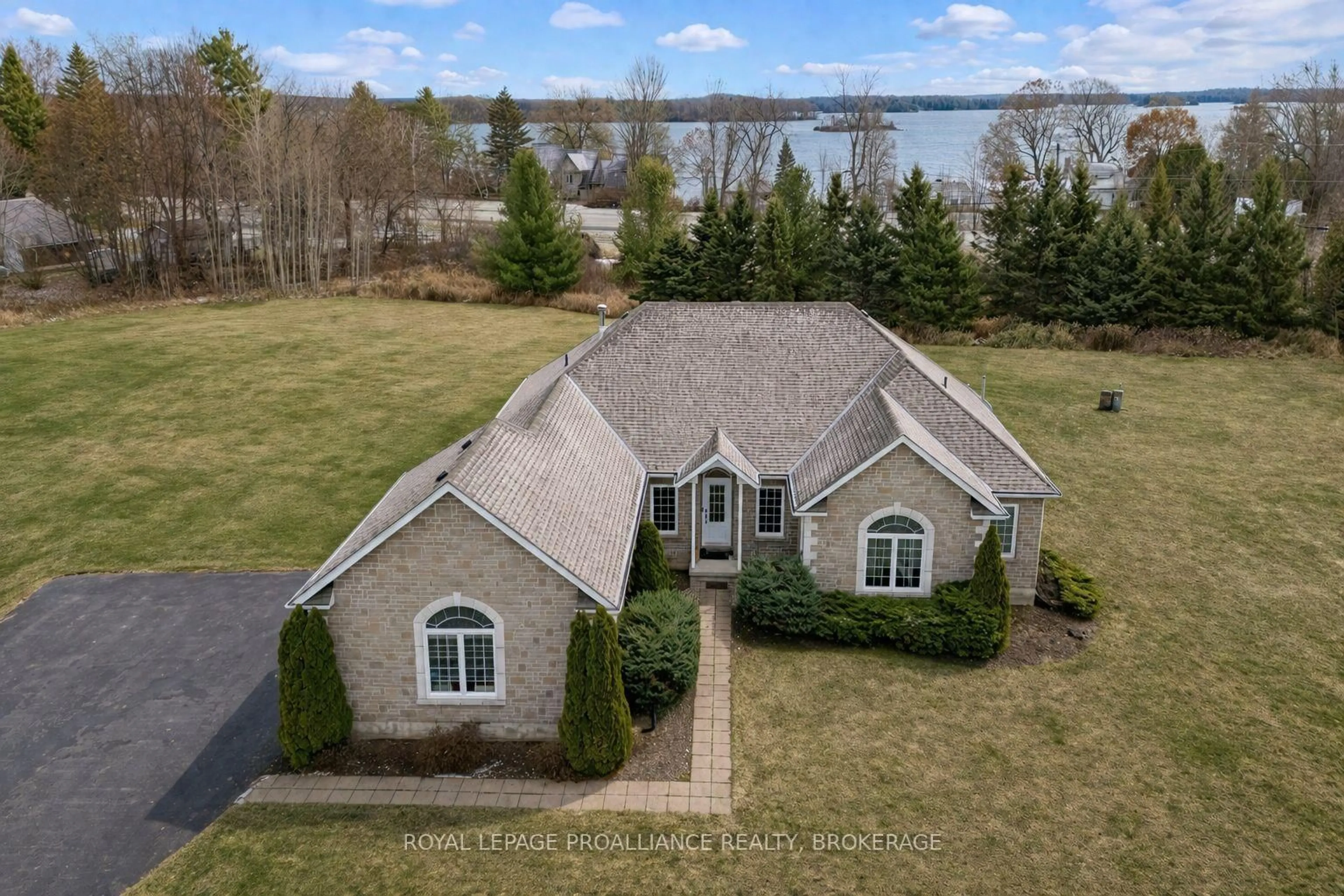 A pic from outside/outdoor area/front of a property/back of a property/a pic from drone, water/lake/river/ocean view for 61 Conner Dr, Gananoque Ontario K7G 2V4