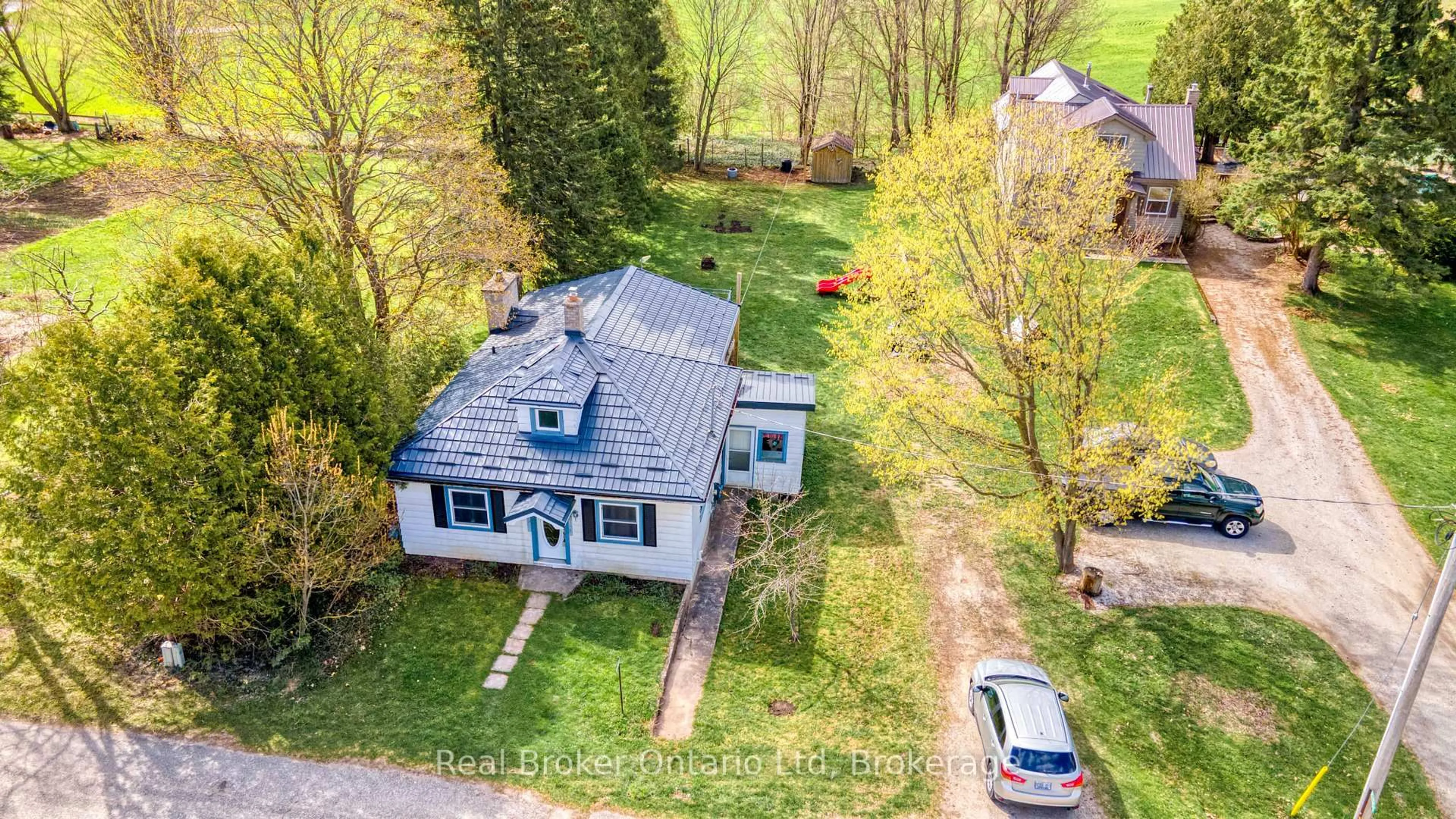 A pic from outside/outdoor area/front of a property/back of a property/a pic from drone, street for 102008 Grey 5 Rd, Georgian Bluffs Ontario N4K 5N5
