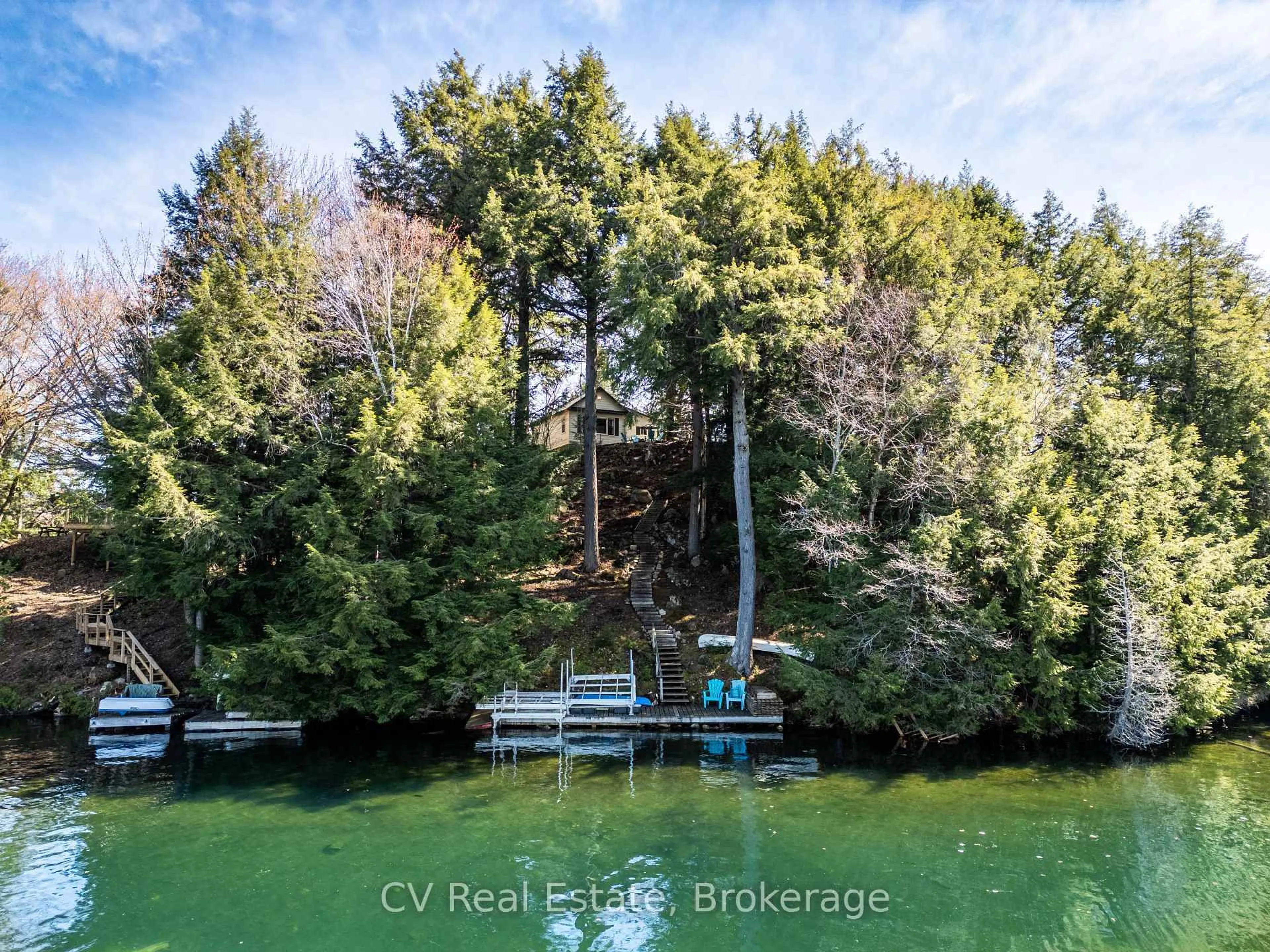 A pic from outside/outdoor area/front of a property/back of a property/a pic from drone, water/lake/river/ocean view for 1117 - Bert Sims Rd #Unit #5, Muskoka Lakes Ontario P0B 1M0