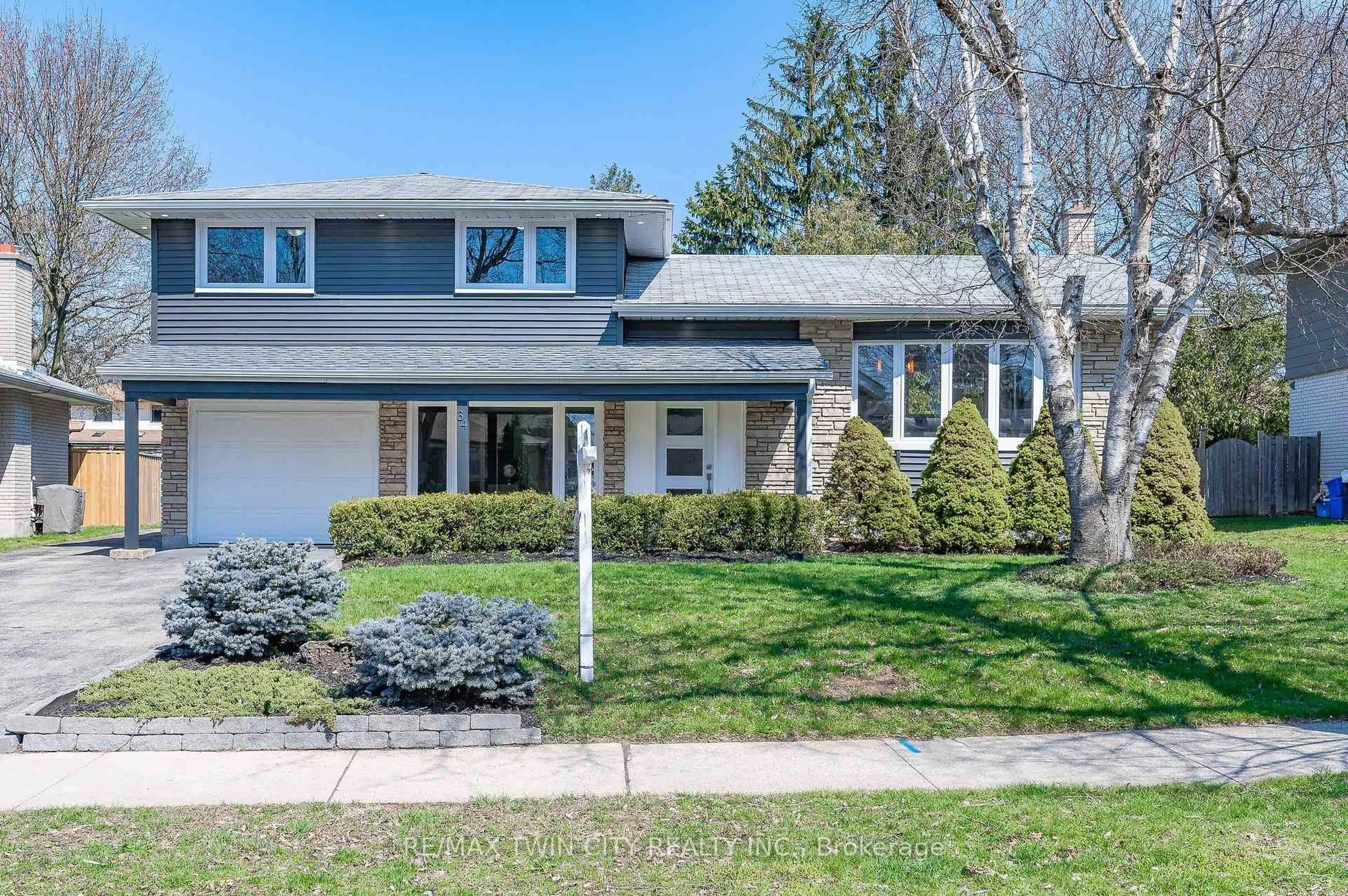 Home with vinyl exterior material, street for 34 BRADLEY Dr, Kitchener Ontario N2A 1K4