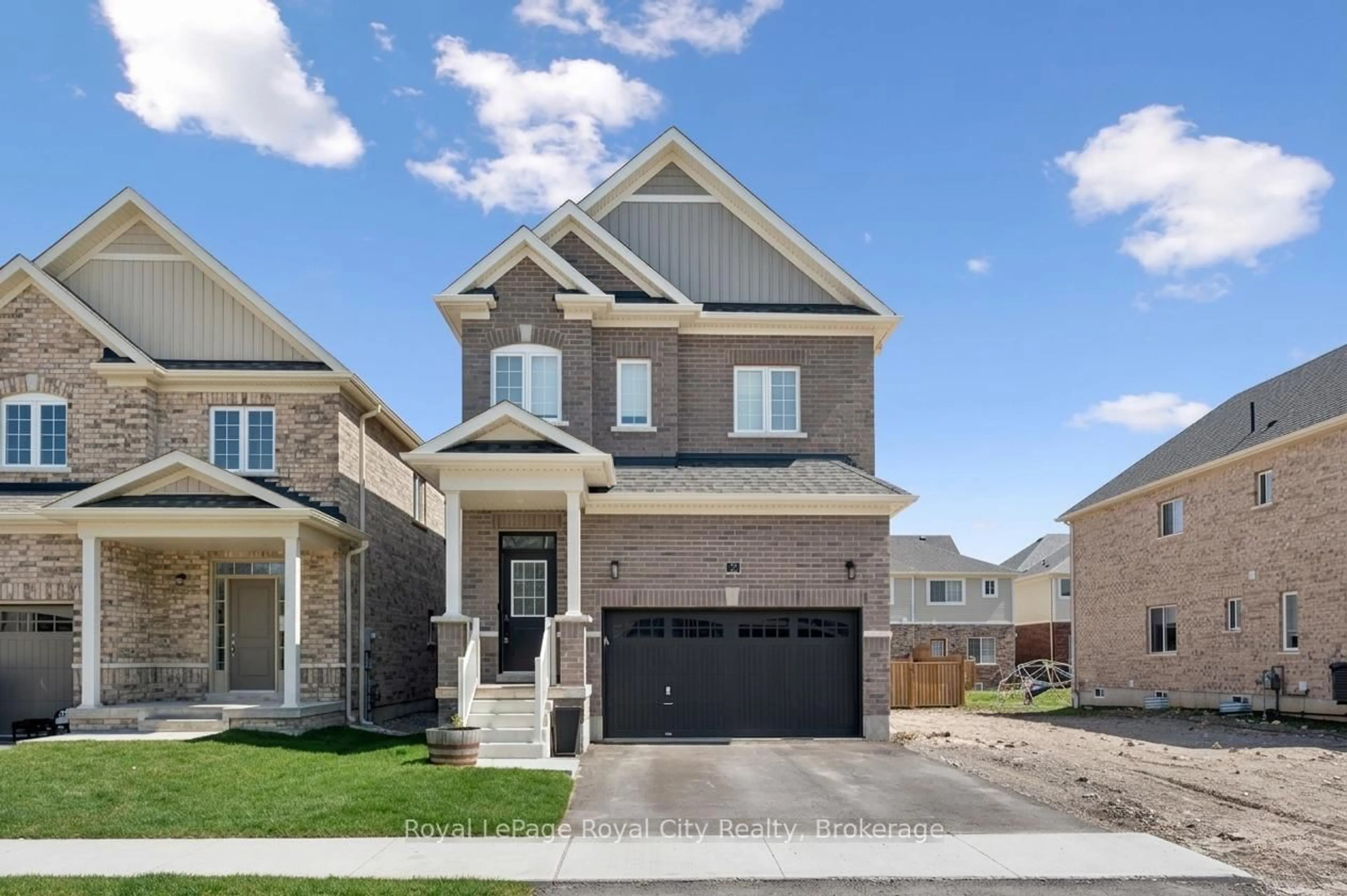 Home with brick exterior material, street for 32 Hutchison Rd, Guelph Ontario N1L 0R4