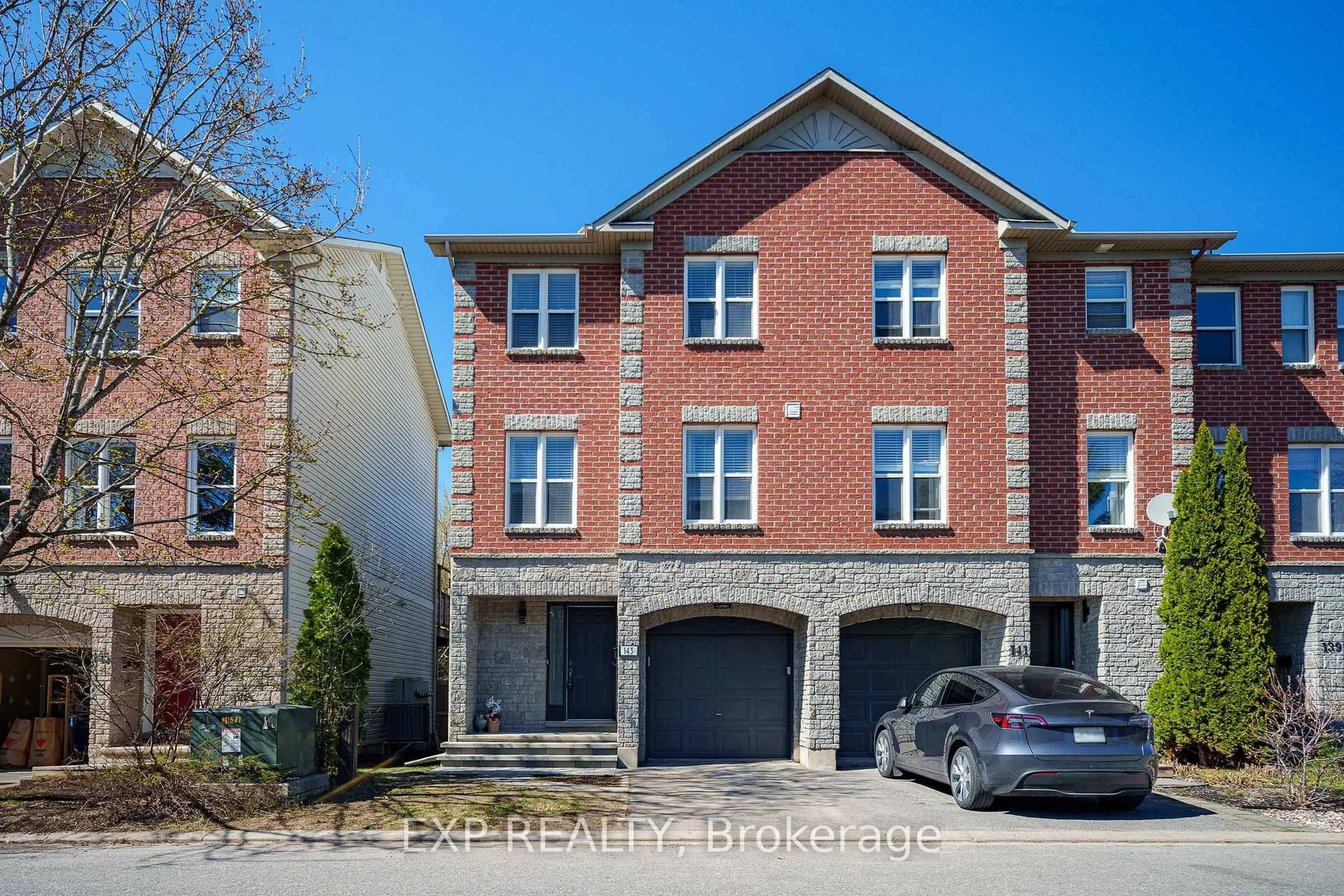 Home with brick exterior material, street for 143 Arcola Private, Ottawa Ontario K1K 4W9