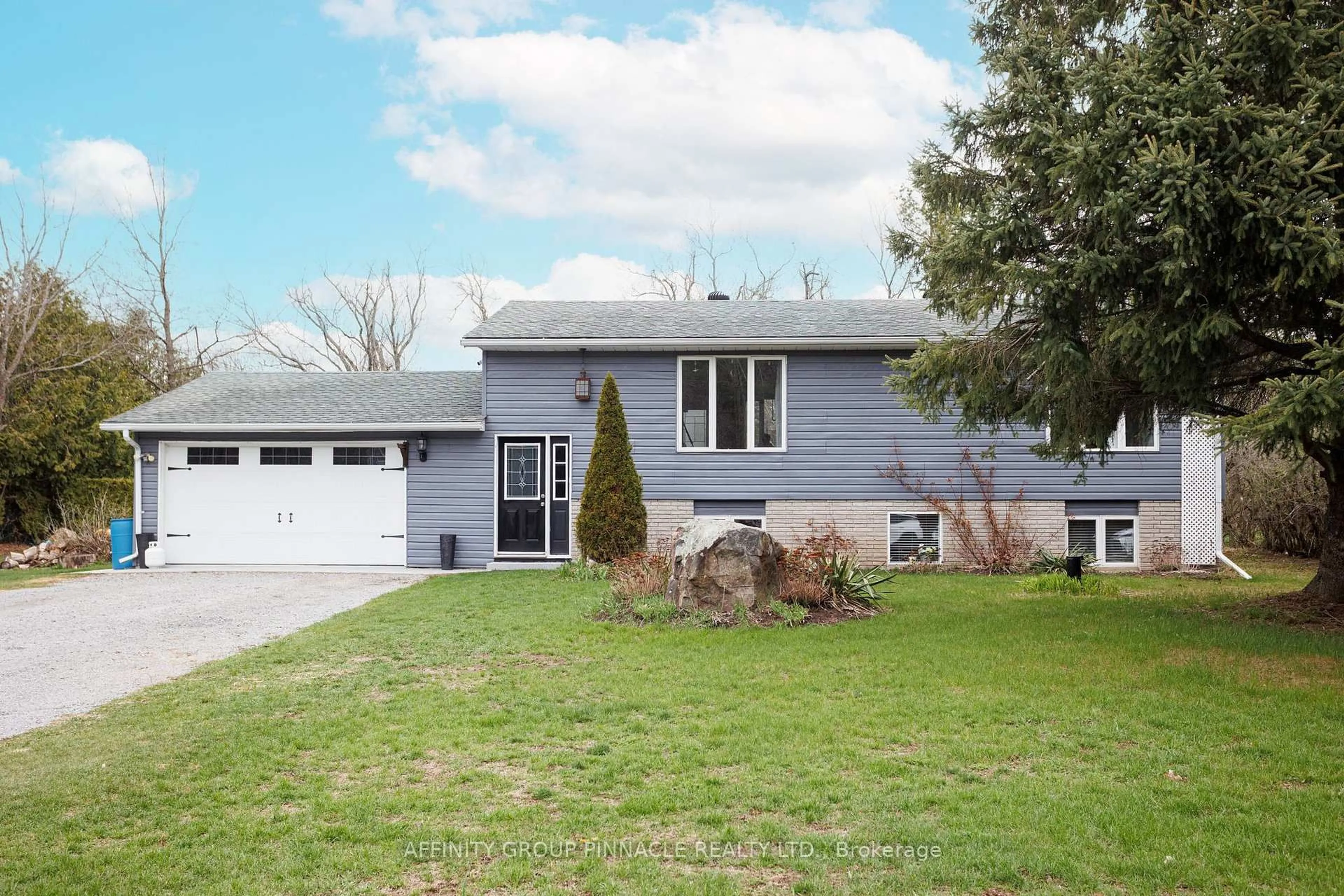 Home with vinyl exterior material, street for 7 Hawk St, Kawartha Lakes Ontario K0M 2T0