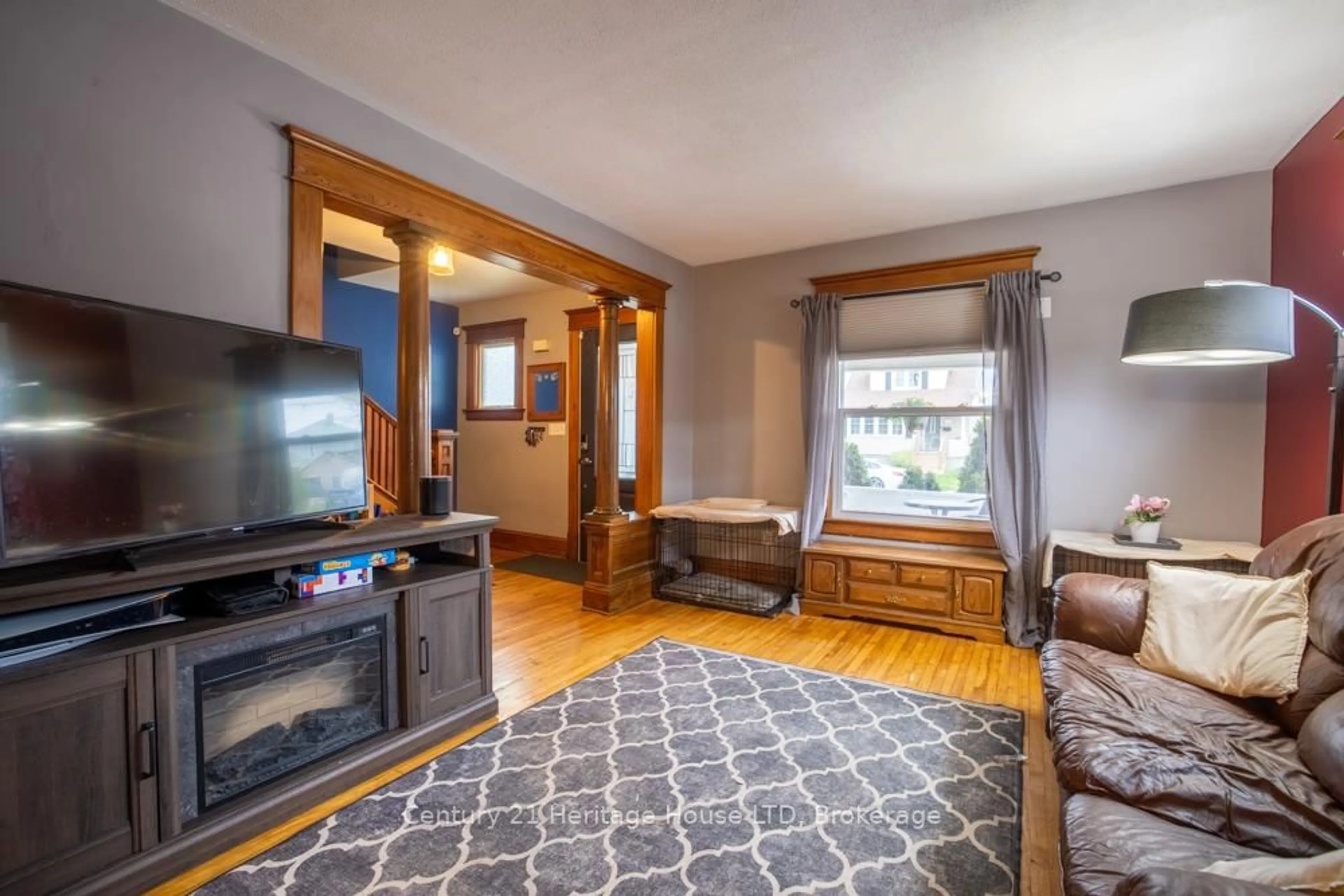 Living room with furniture, wood/laminate floor for 149 Bald St, Welland Ontario L3C 5C5