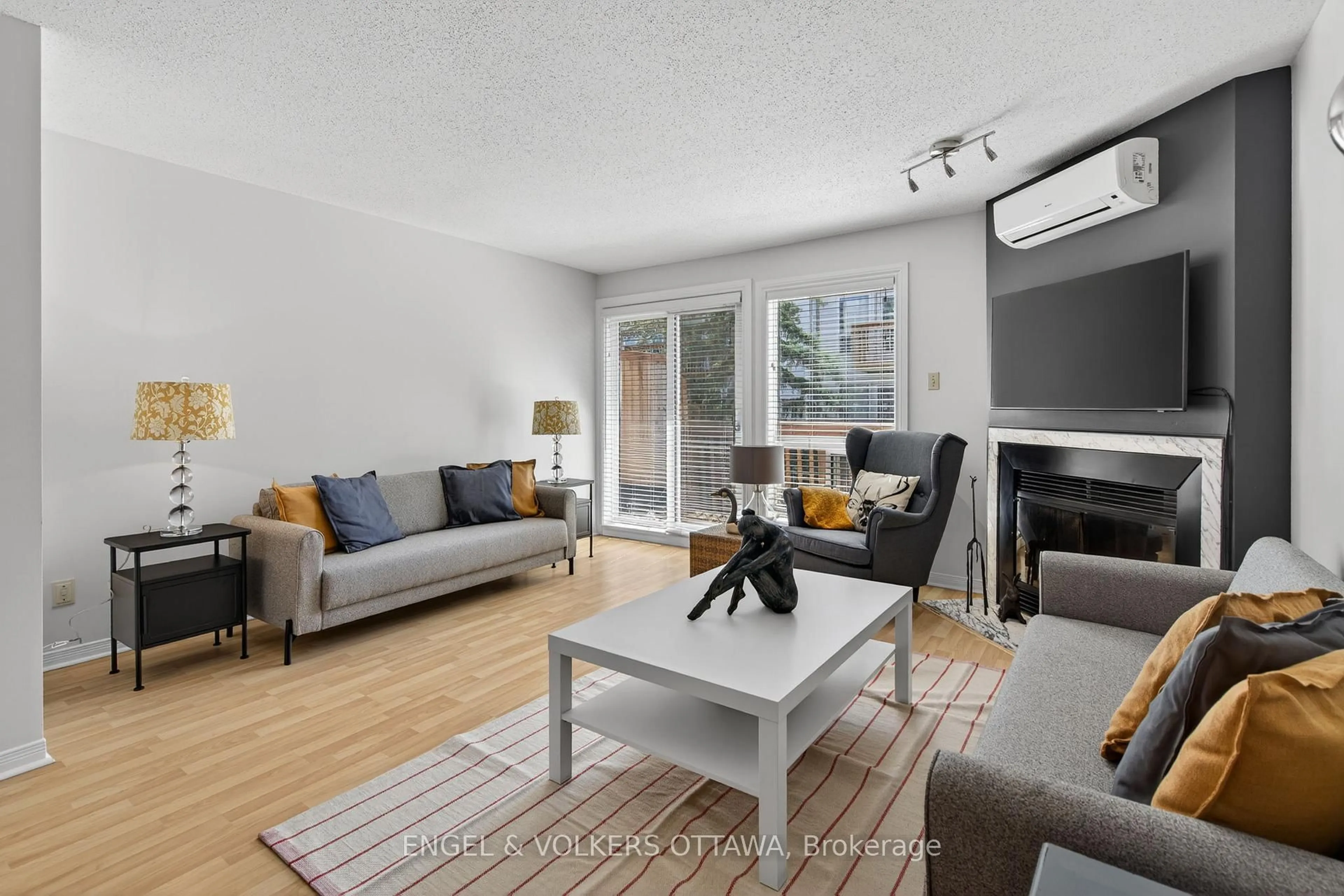 Living room with furniture, wood/laminate floor for 211 Briston Private, Ottawa Ontario K1G 5R5