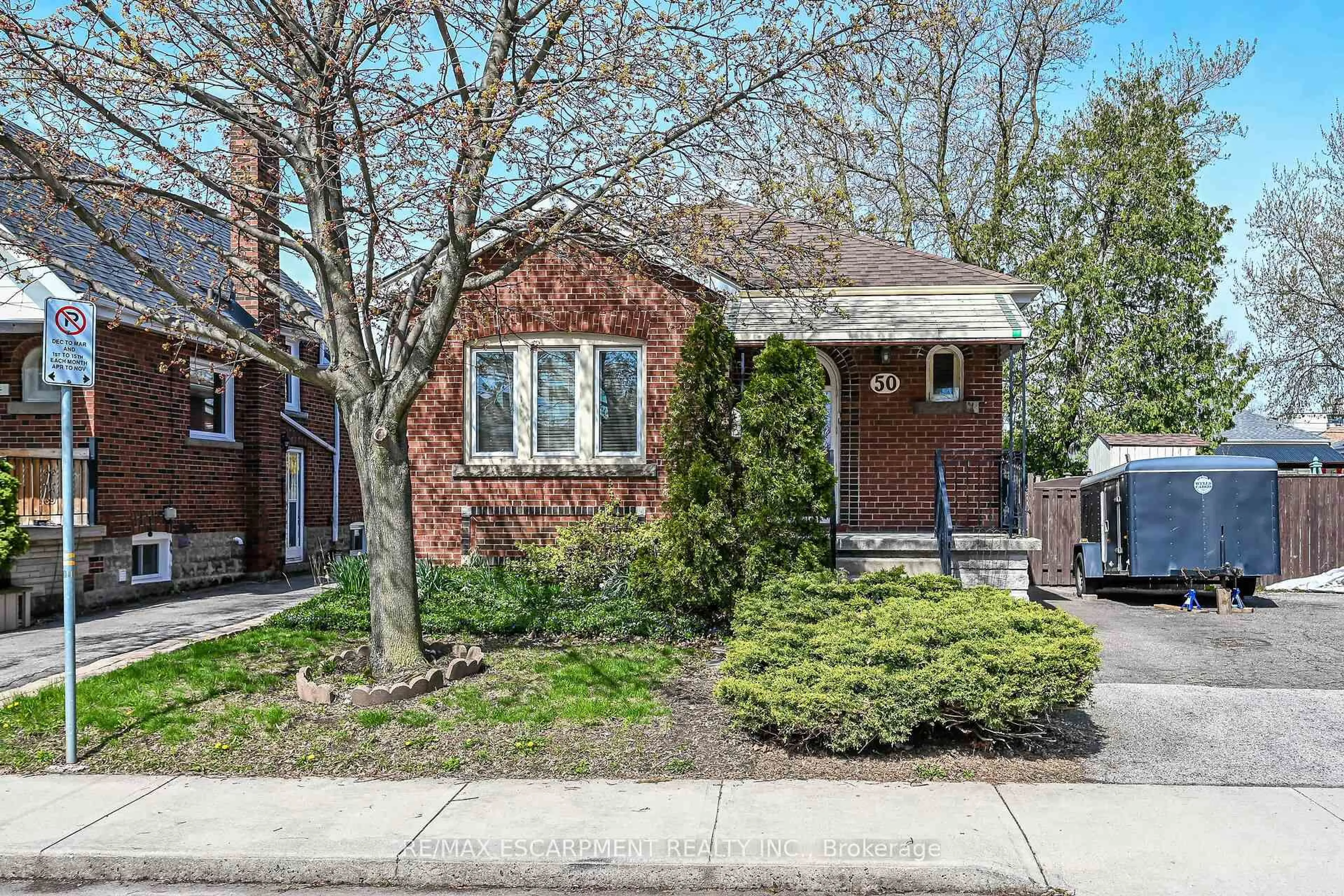 Home with brick exterior material, street for 50 EAST 12TH St, Hamilton Ontario L9A 3X1