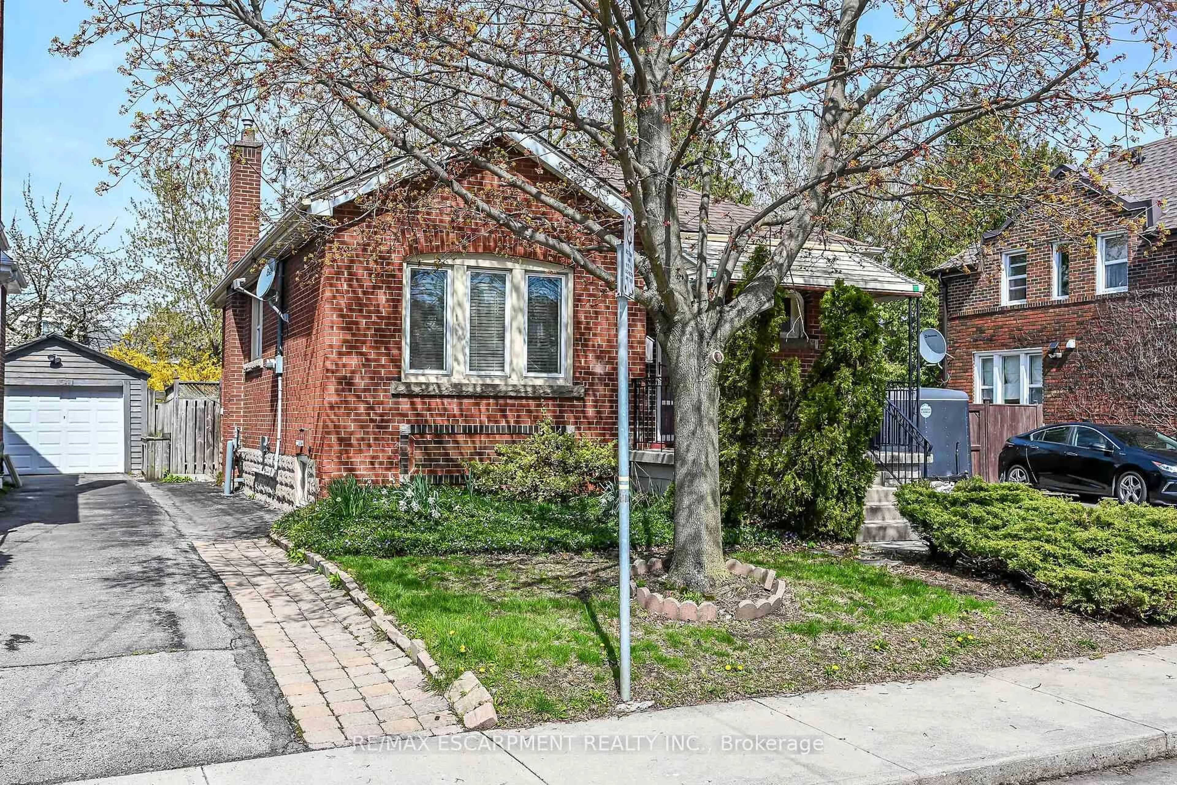Home with brick exterior material, street for 50 EAST 12TH St, Hamilton Ontario L9A 3X1
