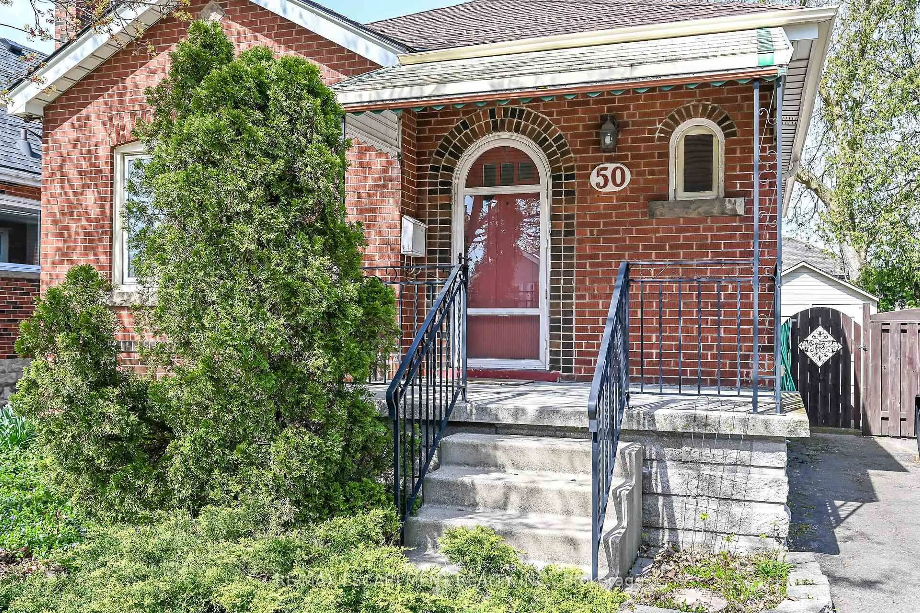 Home with brick exterior material, street for 50 EAST 12TH St, Hamilton Ontario L9A 3X1
