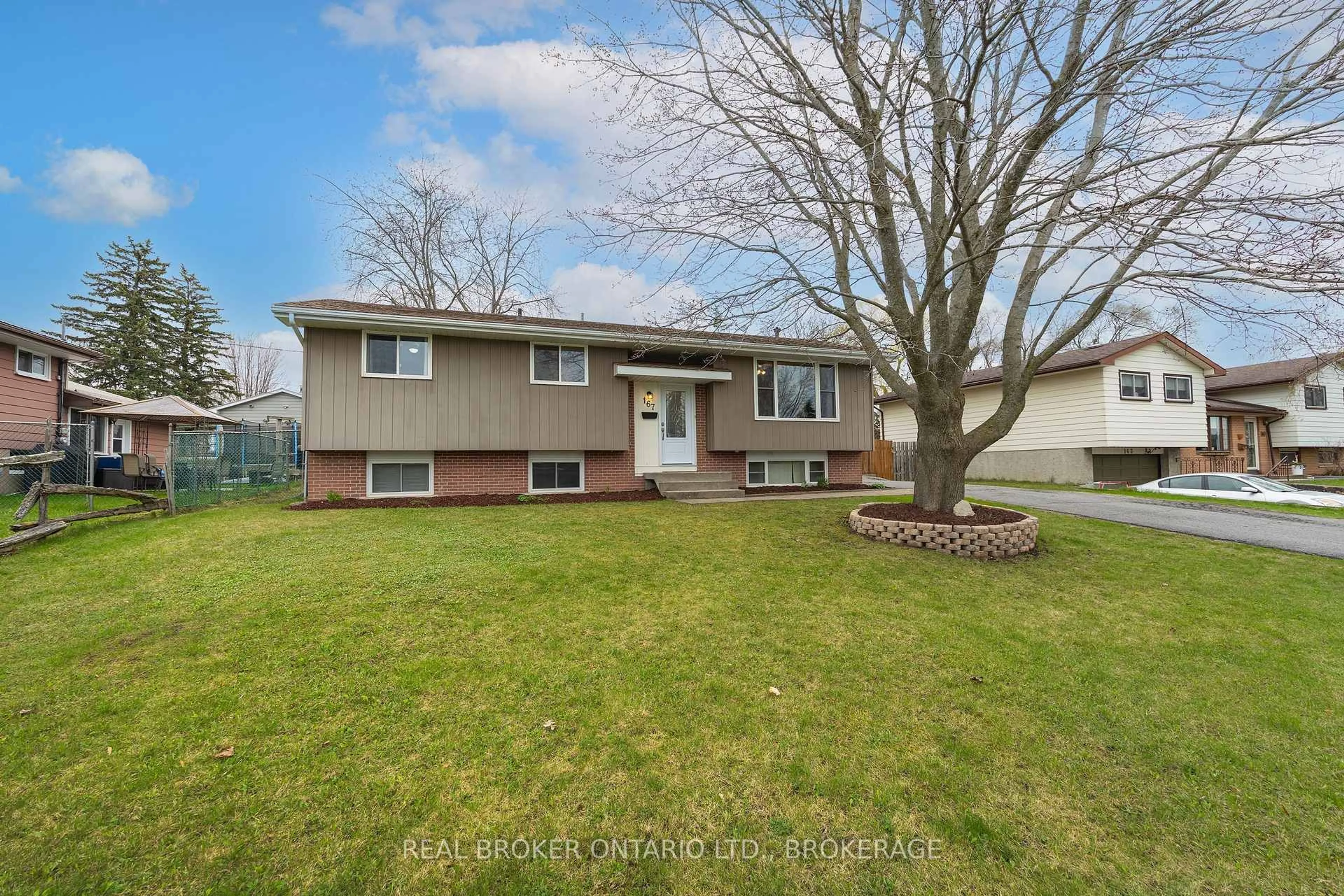 Home with vinyl exterior material, street for 167 MANITOU W Cres, Loyalist Ontario K7N 1C4