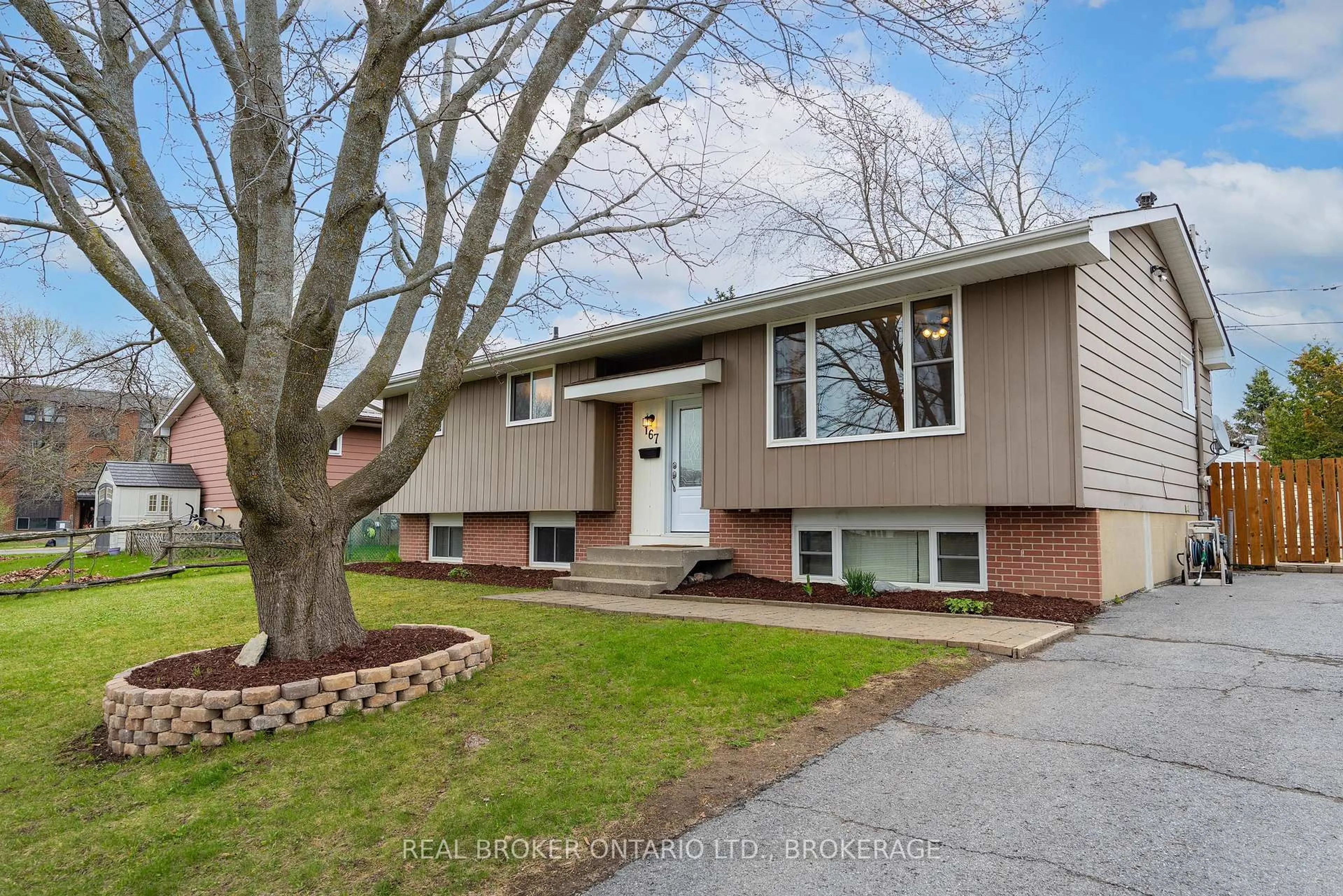 Home with vinyl exterior material, street for 167 MANITOU W Cres, Loyalist Ontario K7N 1C4