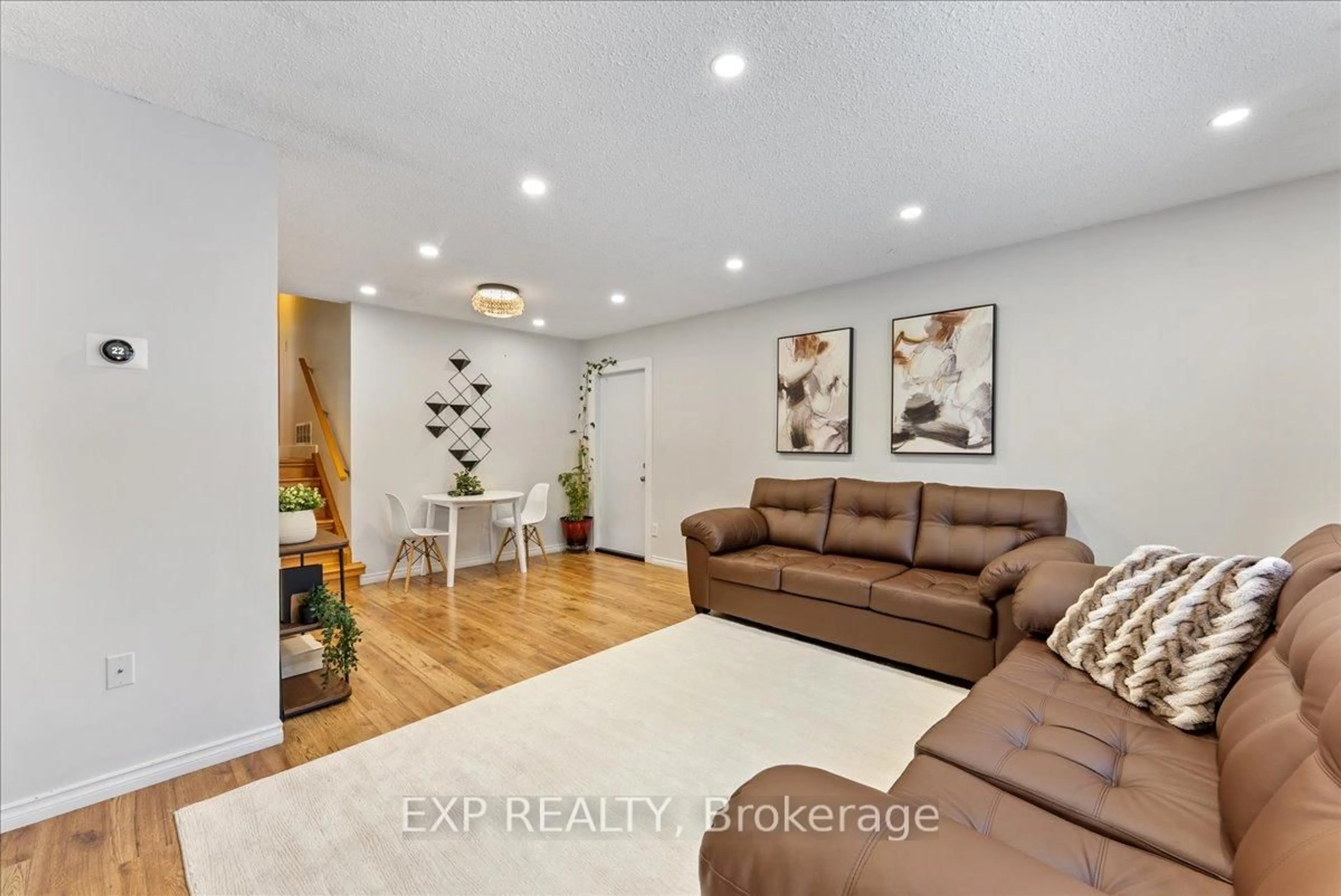 Living room with furniture, wood/laminate floor for 1165 Whitefield Dr, Peterborough Ontario K9J 7R7