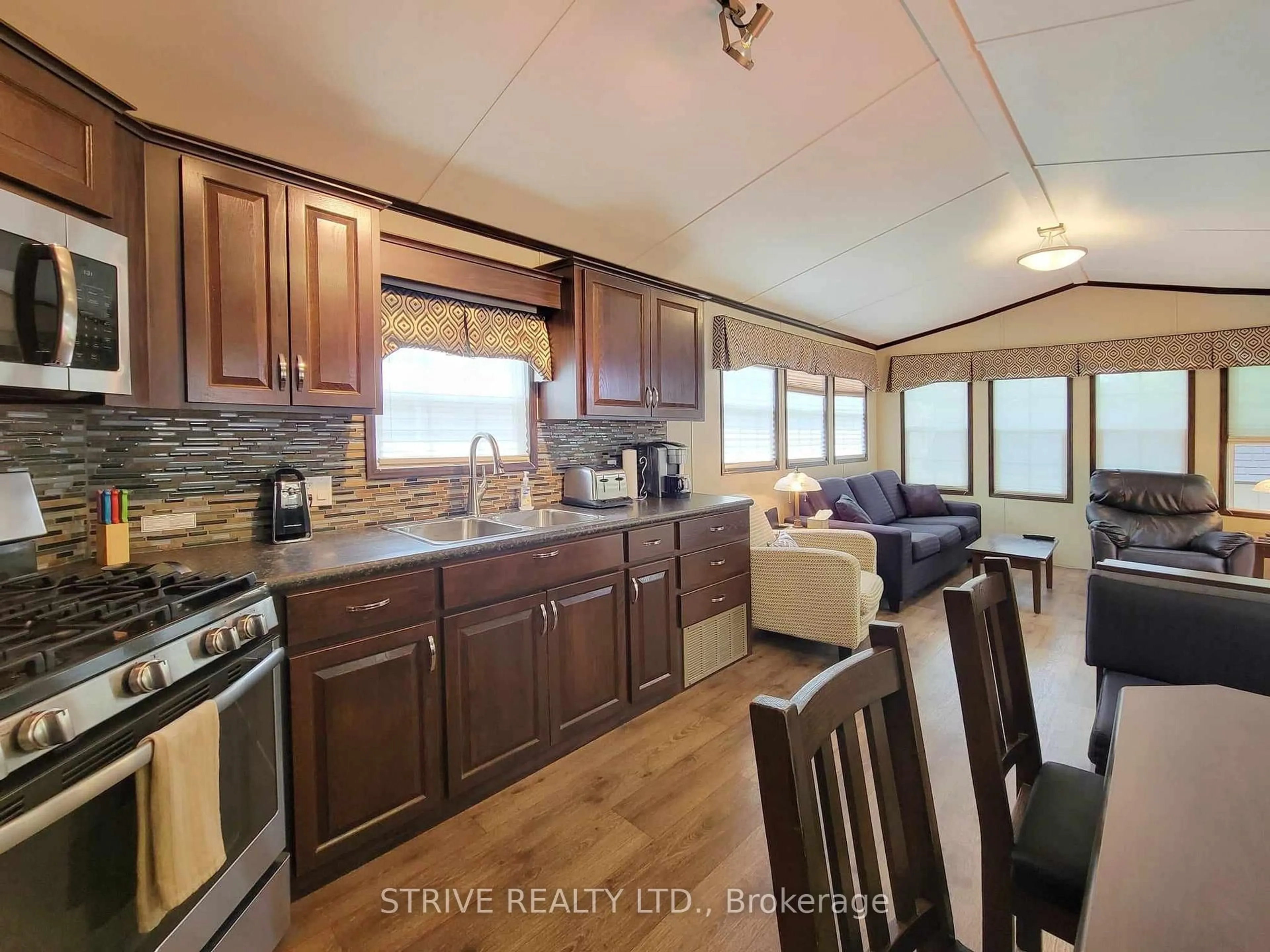 Open concept kitchen, wood/laminate floor for 3-2152 County Rd 36 Rd, Kawartha Lakes Ontario K0M 1L0