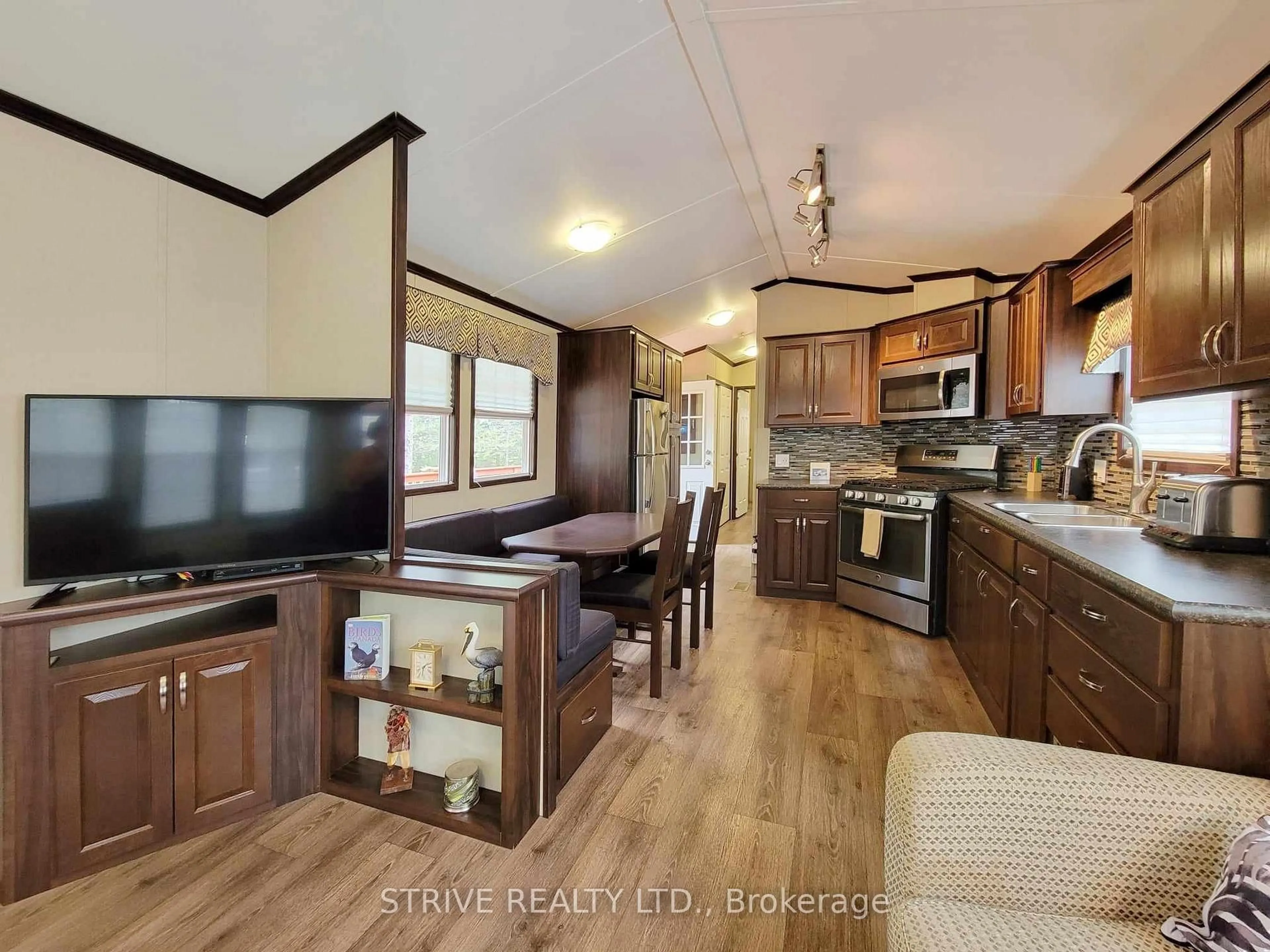 Open concept kitchen, wood/laminate floor for 3-2152 County Rd 36 Rd, Kawartha Lakes Ontario K0M 1L0
