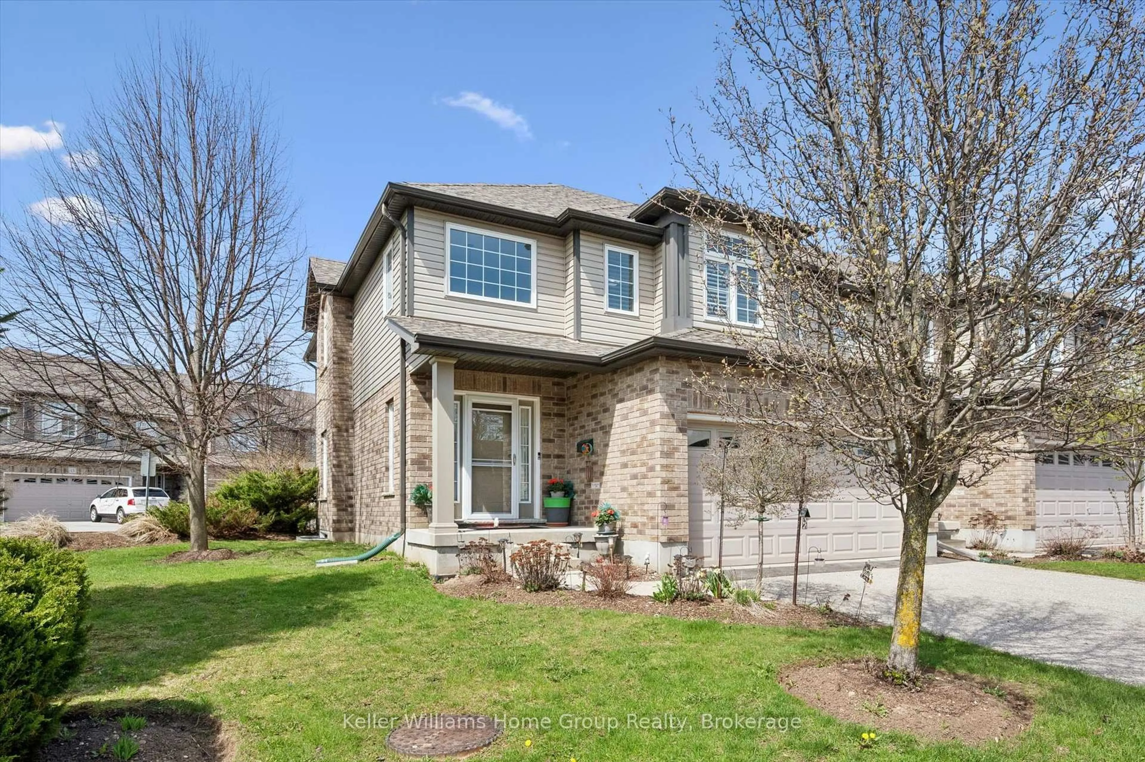 Home with brick exterior material, street for 24 Lowes Rd #16, Guelph Ontario N1L 0J5
