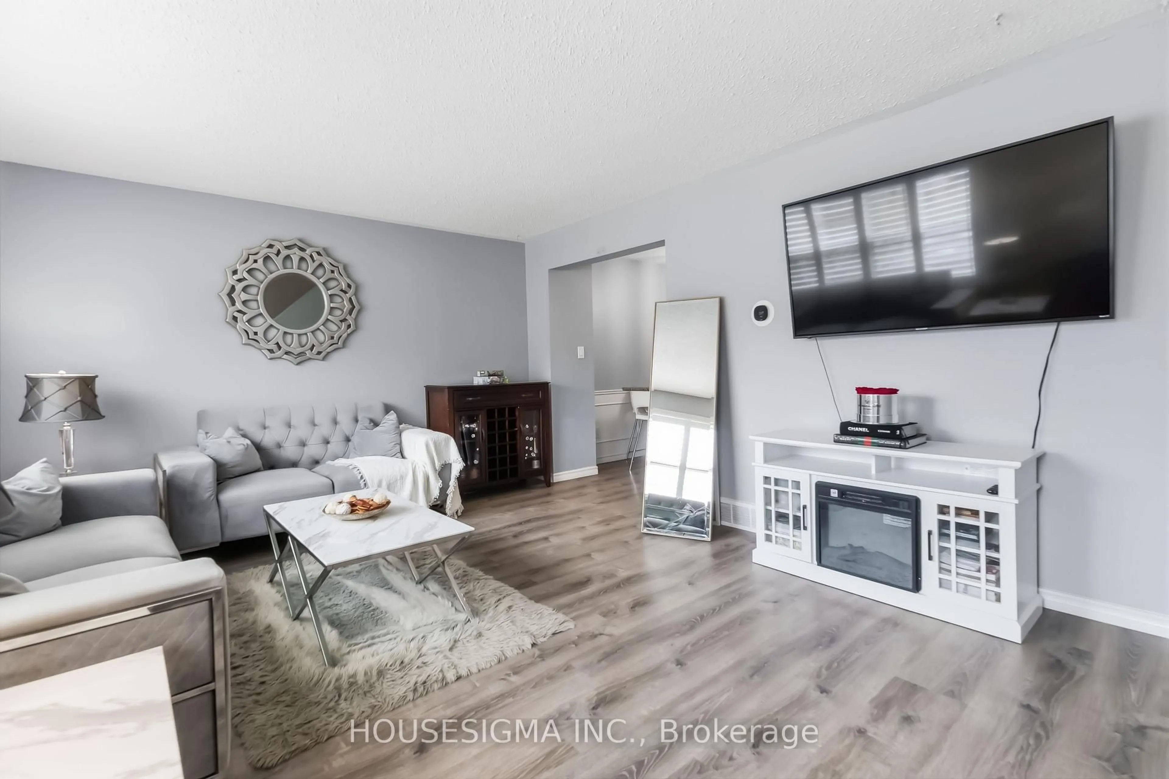Living room with furniture, wood/laminate floor for 861 DEARNESS Dr, London South Ontario N6E 1Y4