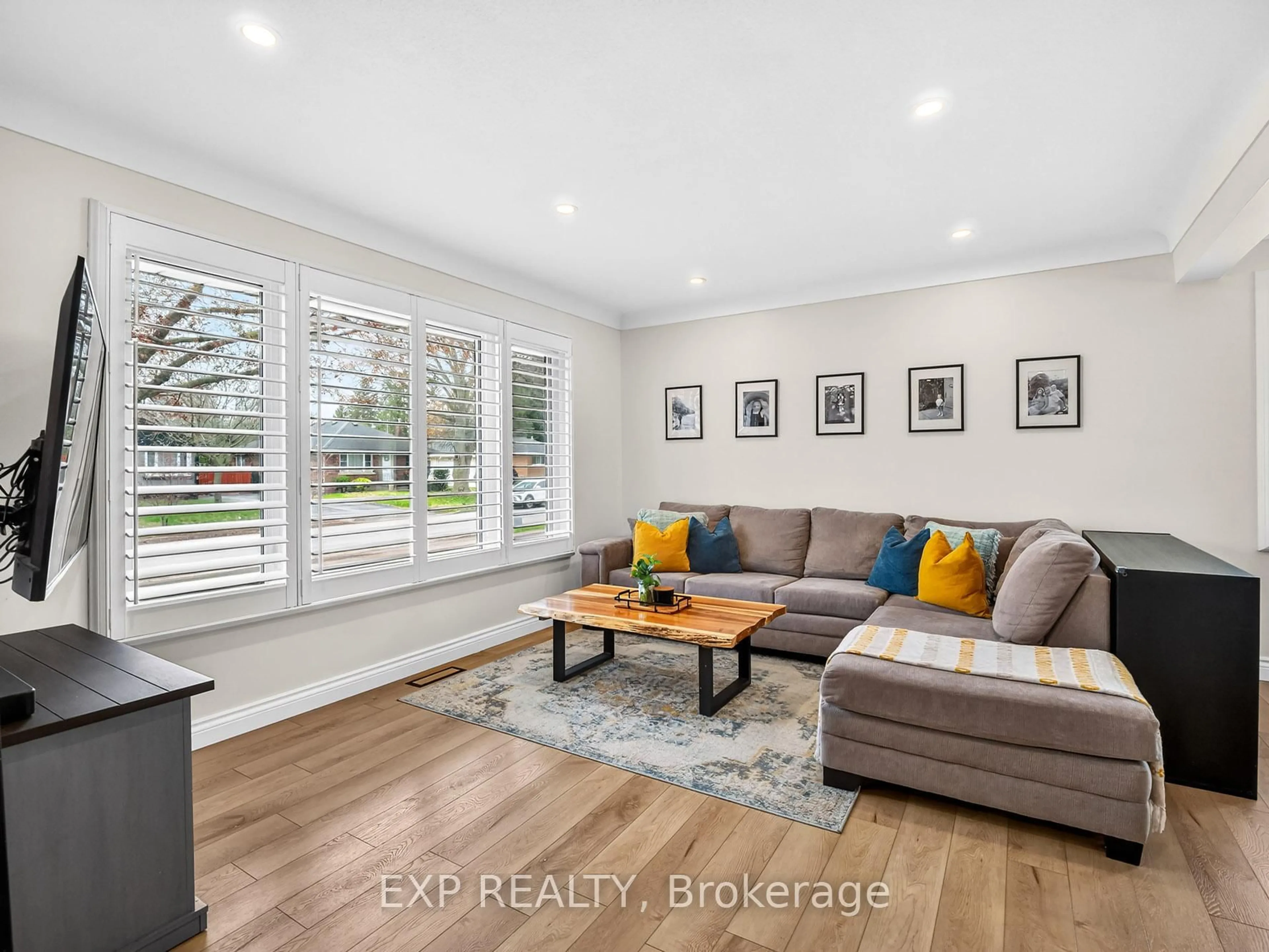 Living room with furniture, wood/laminate floor for 5010 David Ave, Niagara Falls Ontario L2E 5C8