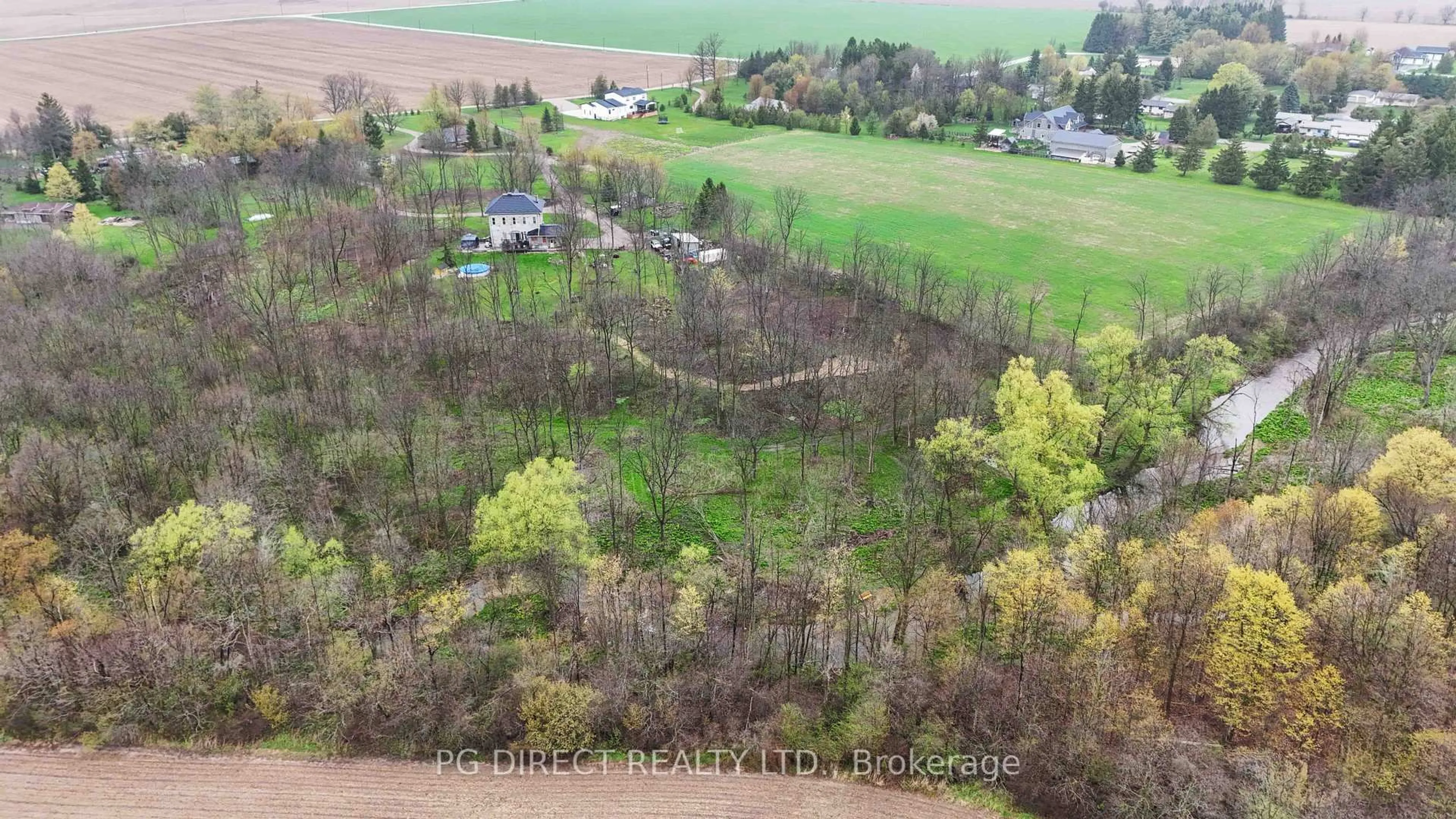 A pic from outside/outdoor area/front of a property/back of a property/a pic from drone, forest/trees view for 12096 Gale Rd, North Middlesex Ontario N0M 1A0