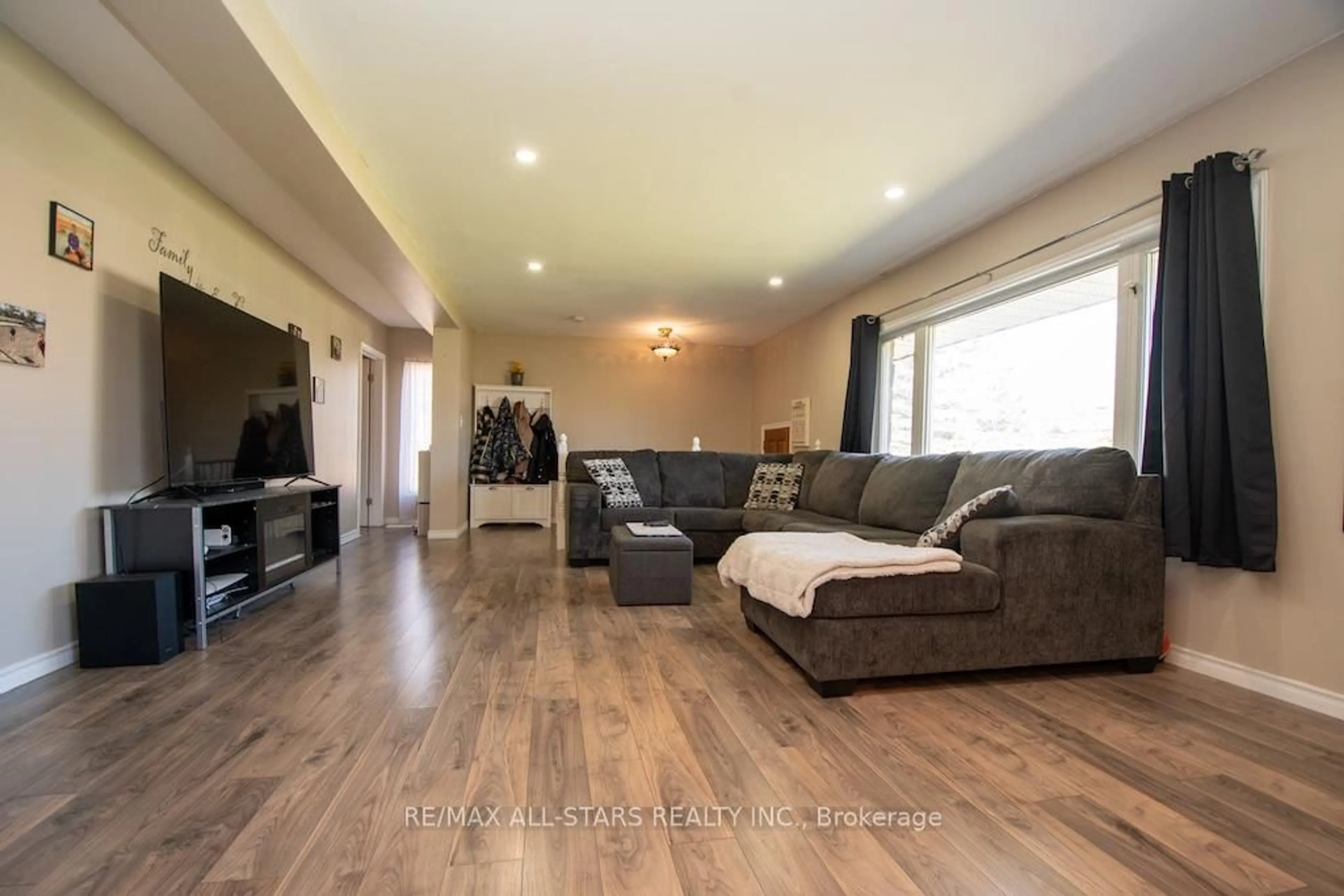 Living room with furniture, wood/laminate floor for 1426 Highway 7A, Kawartha Lakes Ontario L0A 1A0