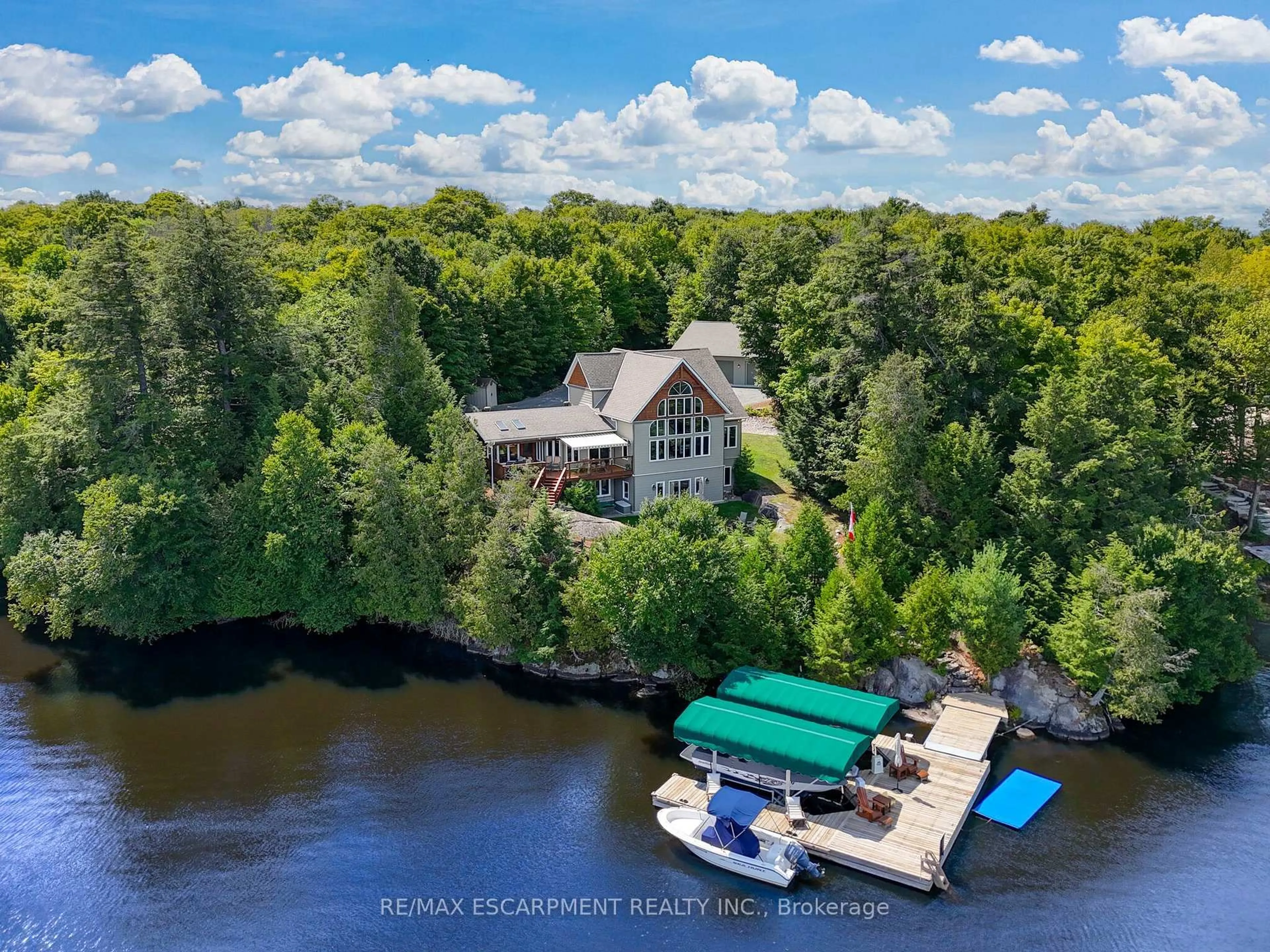 A pic from outside/outdoor area/front of a property/back of a property/a pic from drone, water/lake/river/ocean view for 36 MANITOUWABING ESTATES Rd, McKellar Ontario P2A 0B5