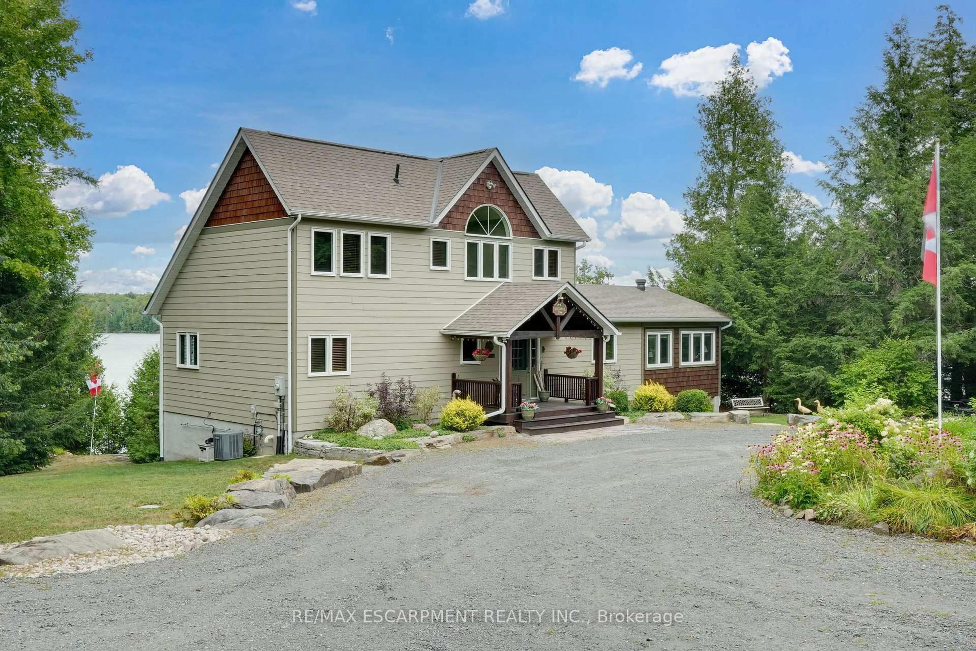 A pic from outside/outdoor area/front of a property/back of a property/a pic from drone, mountain view for 36 MANITOUWABING ESTATES Rd, McKellar Ontario P2A 0B5