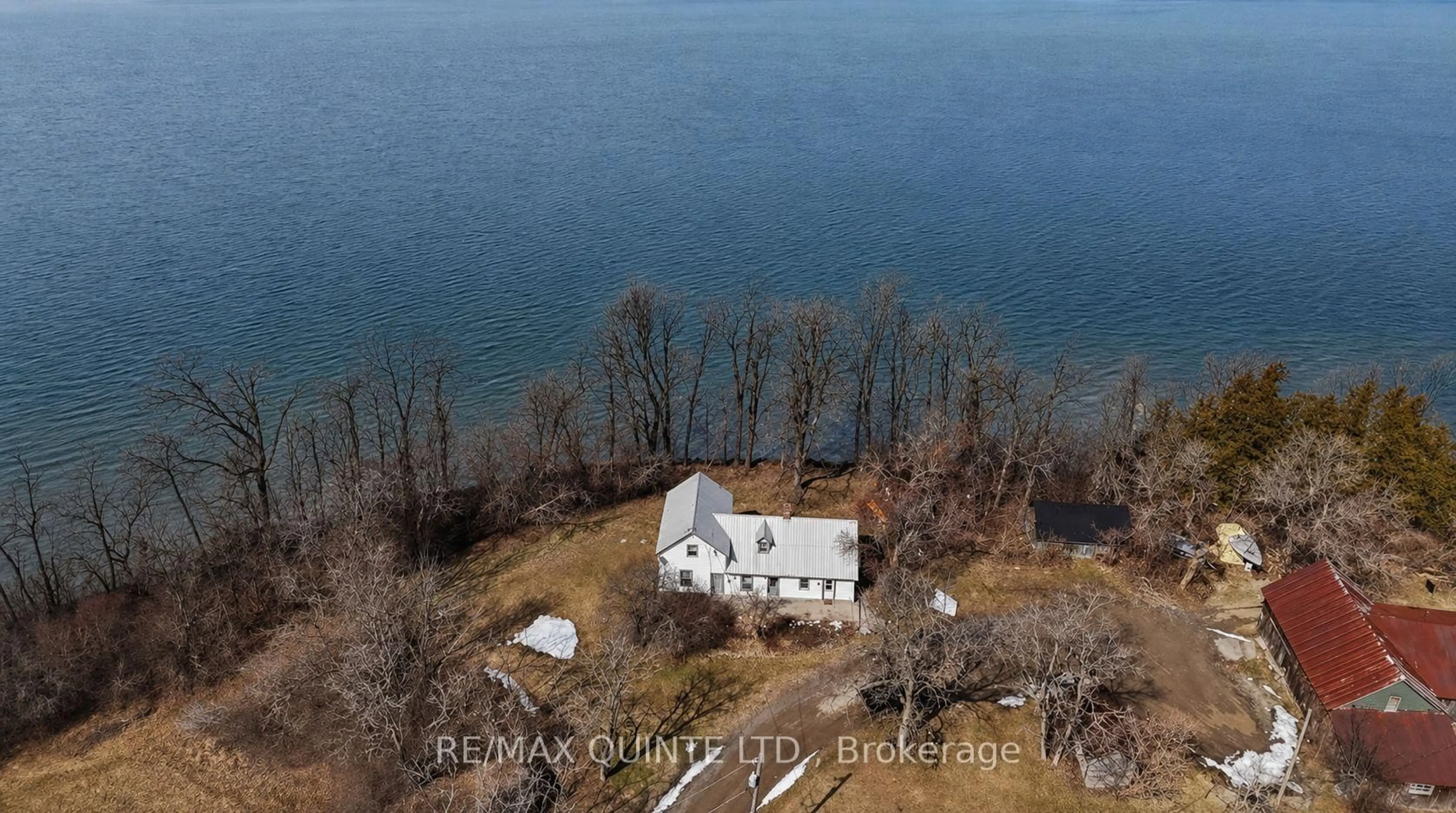 A pic from outside/outdoor area/front of a property/back of a property/a pic from drone, water/lake/river/ocean view for 115 Gibson Rd, Prince Edward County Ontario K0K 1A0