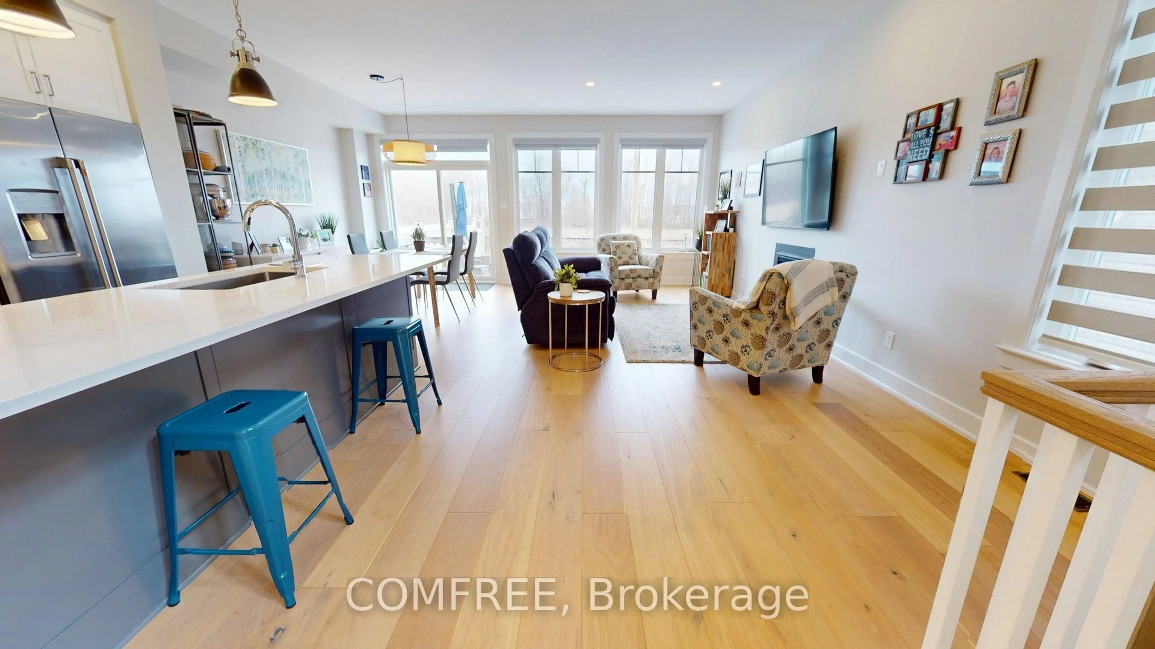 Open concept kitchen, wood/laminate floor for 663 Putney Cres, Ottawa Ontario K2S 2N7